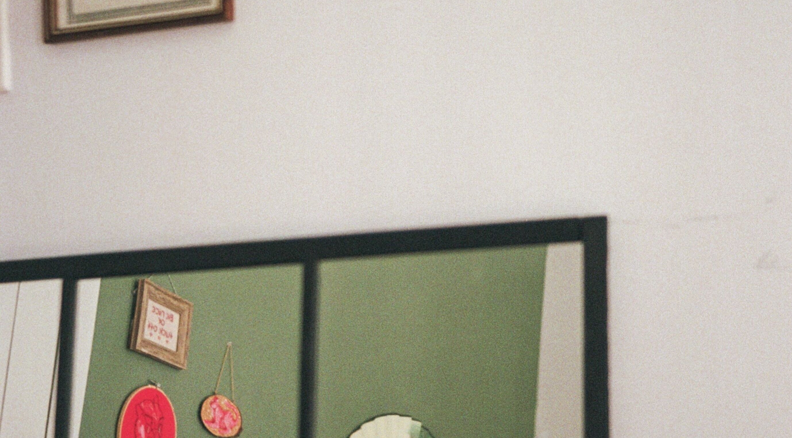 Charming wall decor inside Kate de Tigres, located in Porto, Porto, PT, featuring eclectic art pieces.