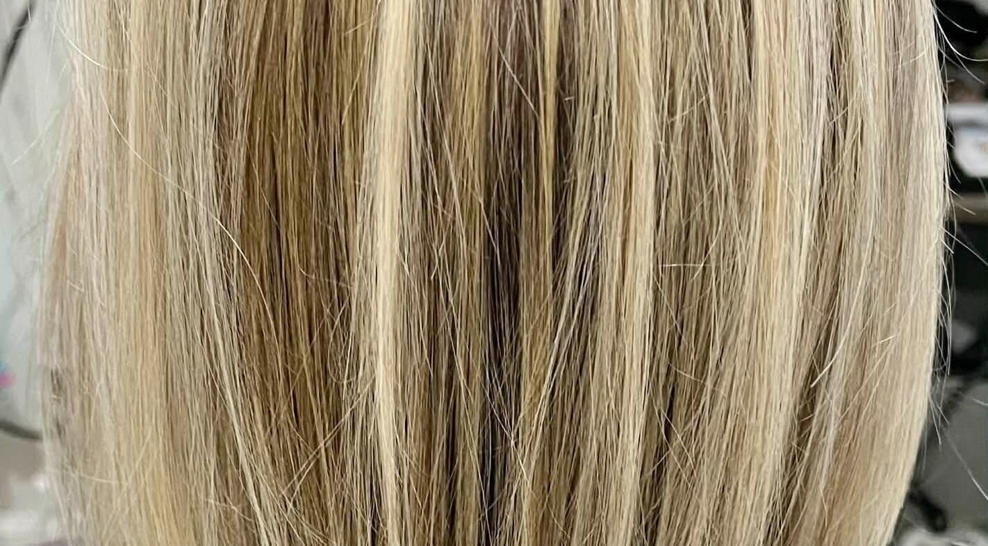 Blonde hair with silky highlights at Hair by Crystal Gayle, Jacksonville, Florida, US.