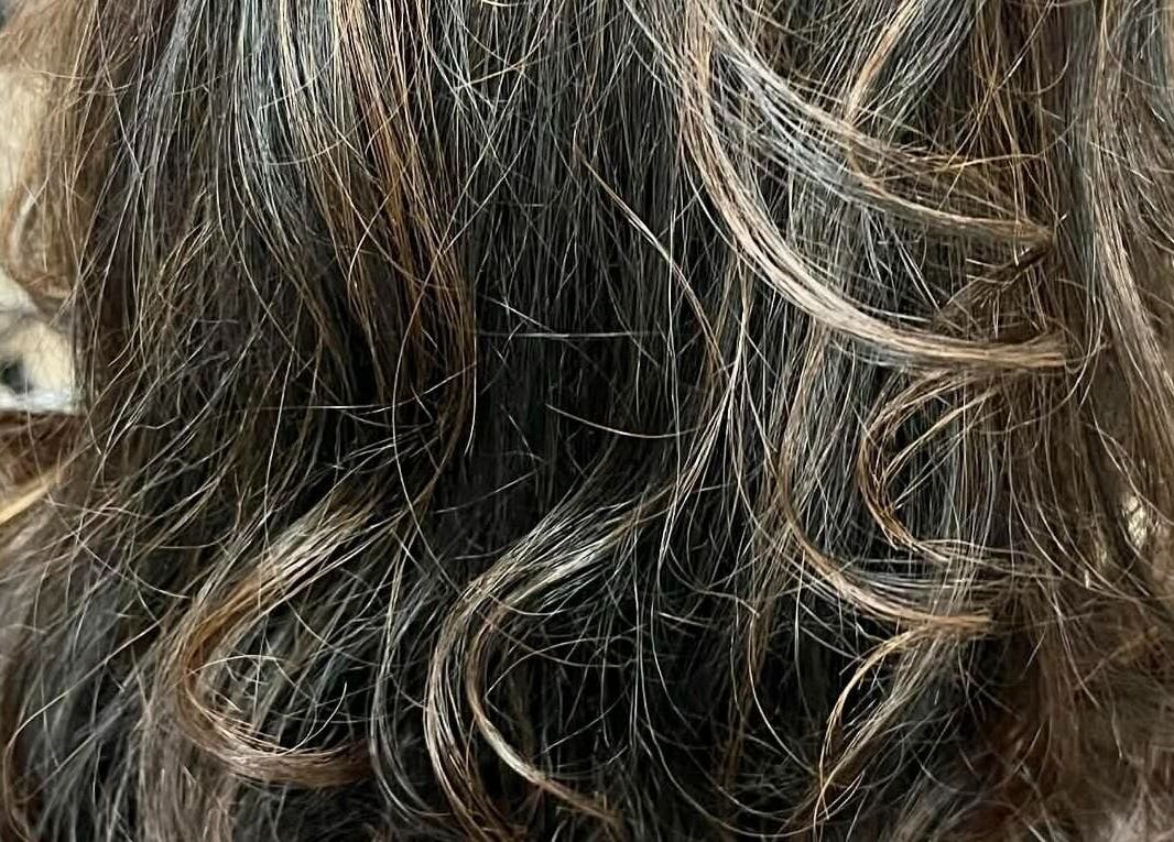 Elegant wavy hairstyle created at Hair by Crystal Gayle, Jacksonville, Florida, US.