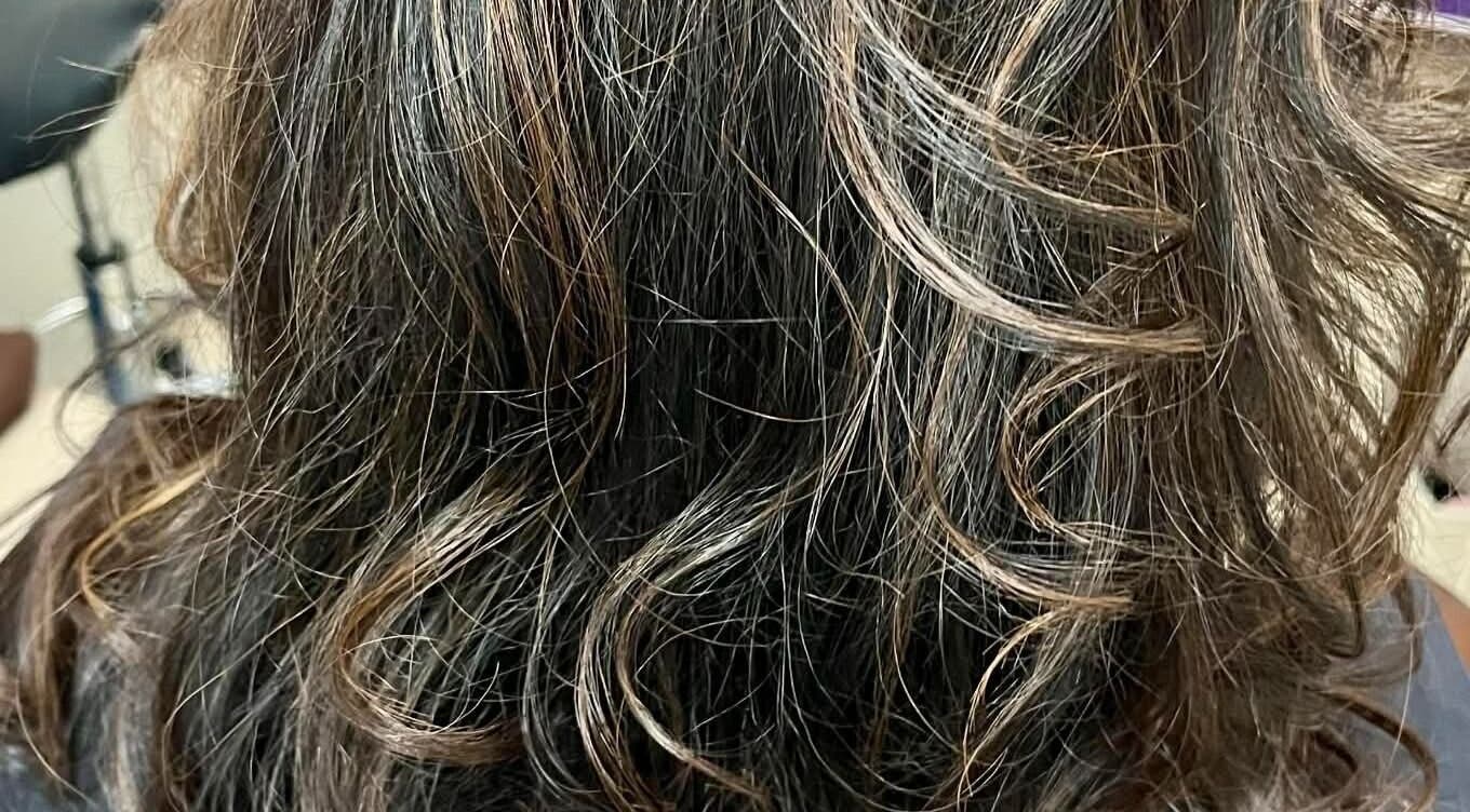 Elegant wavy hairstyle created at Hair by Crystal Gayle, Jacksonville, Florida, US.