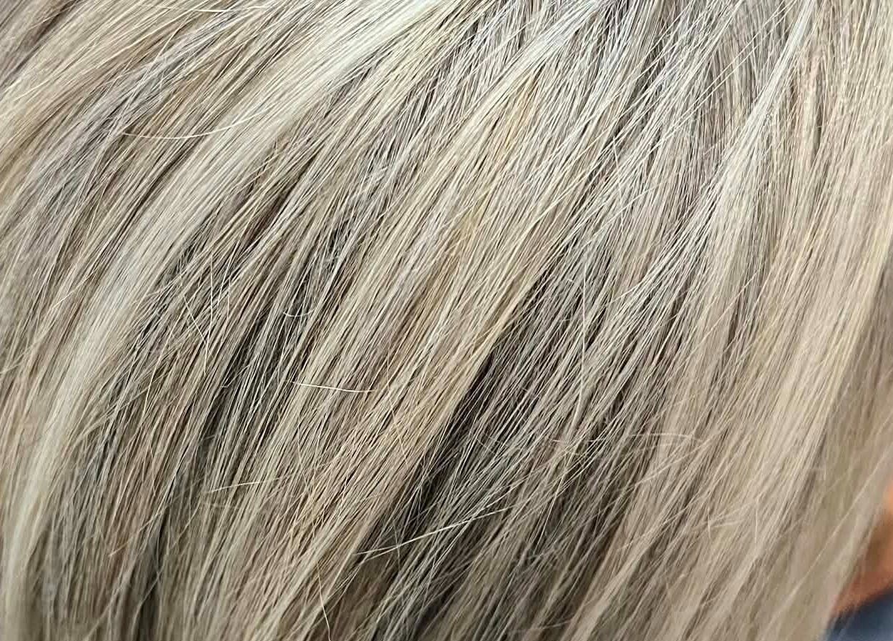 Blonde hair close-up at Hair by Crystal Gayle, Jacksonville, Florida, US, showcasing expert coloring.