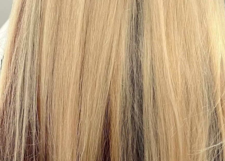 Bright blonde hair styled at Hair by Crystal Gayle, Jacksonville, Florida, US, showcasing sleek and straight finish.