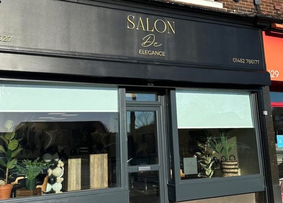 Exterior of Navie Studio, Hull, England, GB, showcasing modern black design and elegant window displays.