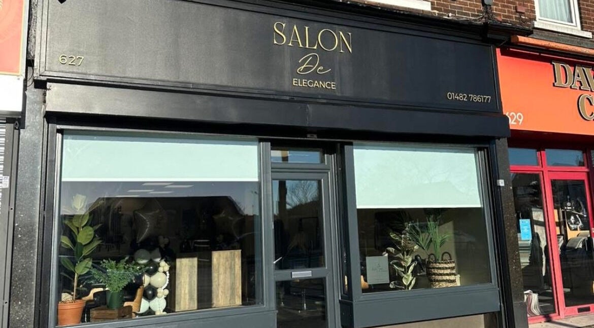 Exterior of Navie Studio, Hull, England, GB, showcasing modern black design and elegant window displays.