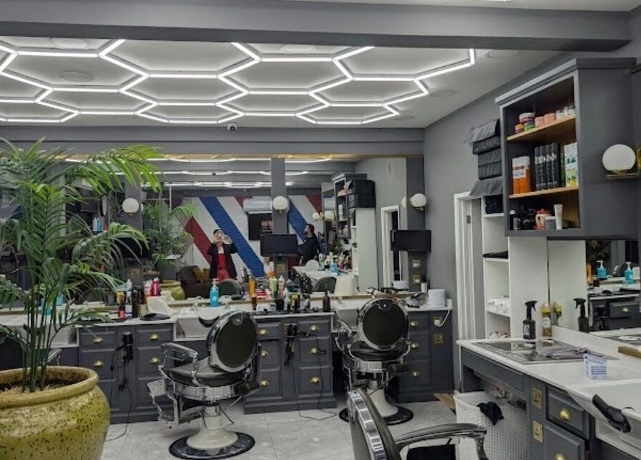 Stylish interior of Turkish Barber in Birmingham, England, GB showcasing modern decor and cozy chairs.