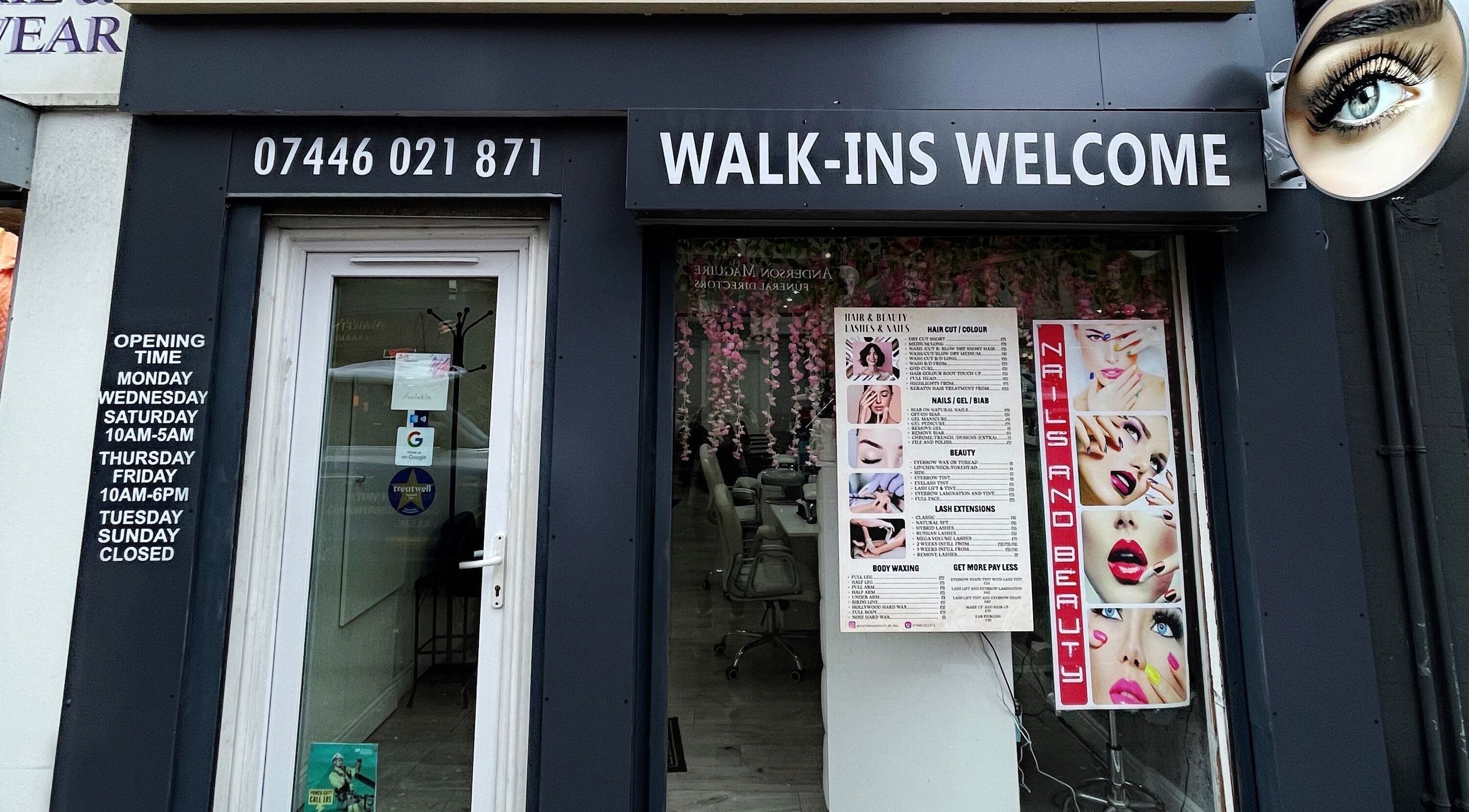 Entrance of Marj Glam Beauty in Glasgow, Scotland, GB, displaying services and welcoming walk-ins.