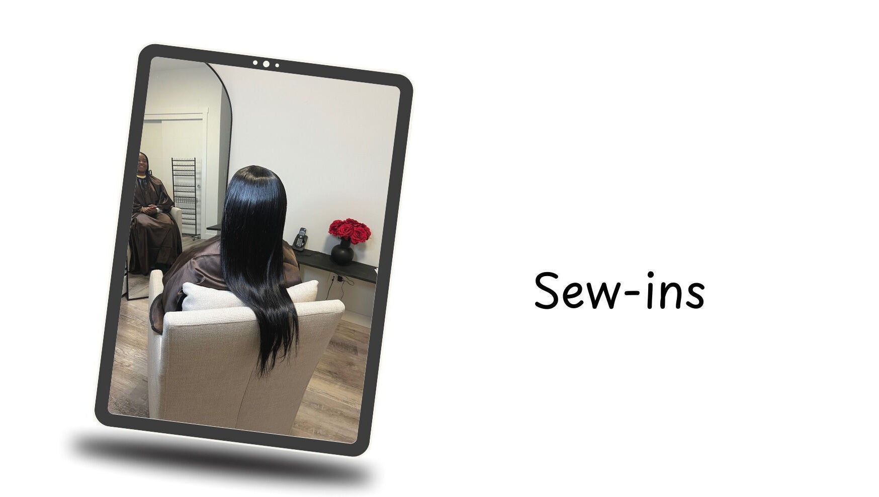 Hair styling at Crown & Co, Edmonton, Alberta, CA shown in a salon mirror with sleek long hair.