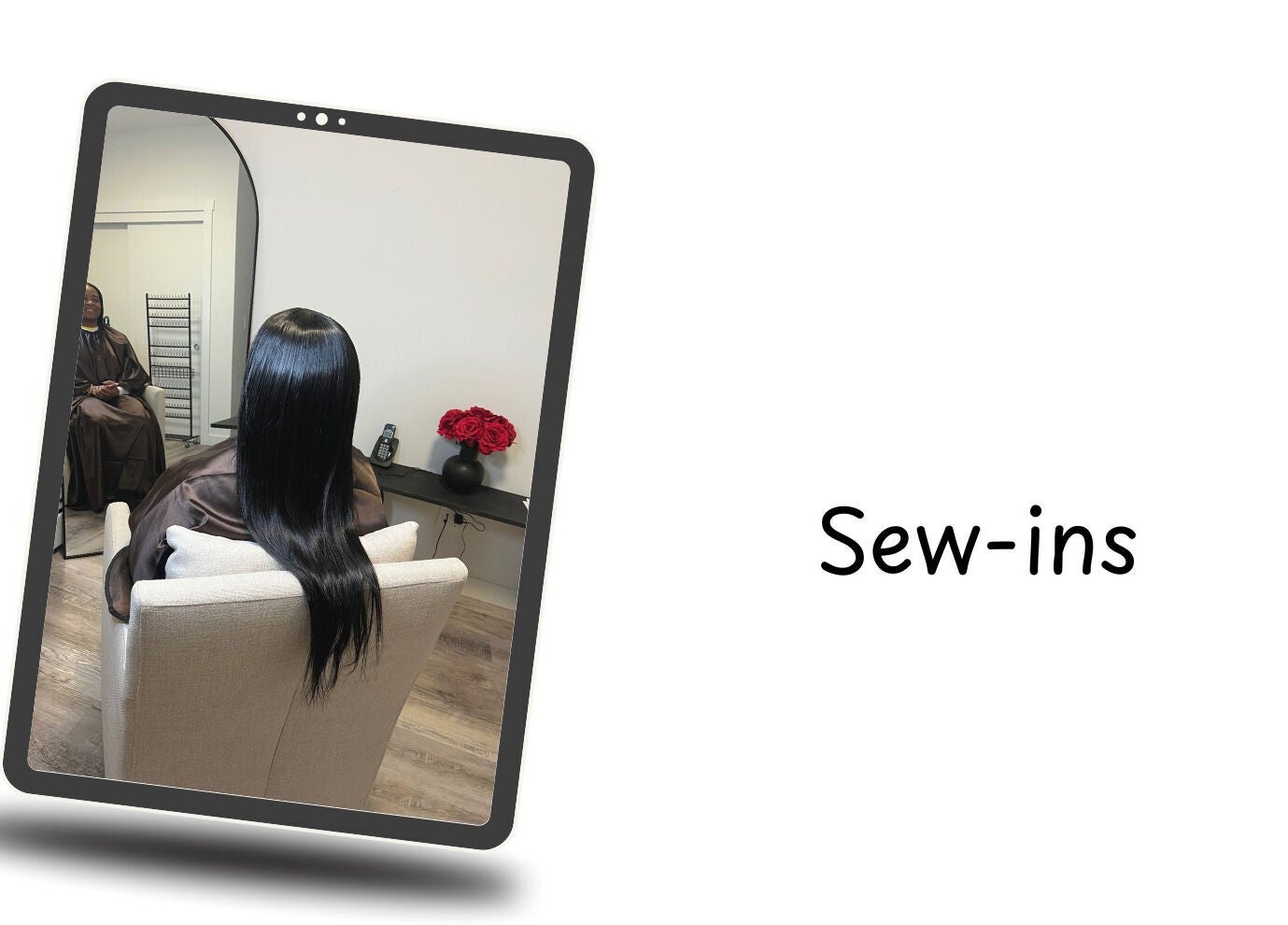 Hair styling at Crown & Co, Edmonton, Alberta, CA shown in a salon mirror with sleek long hair.