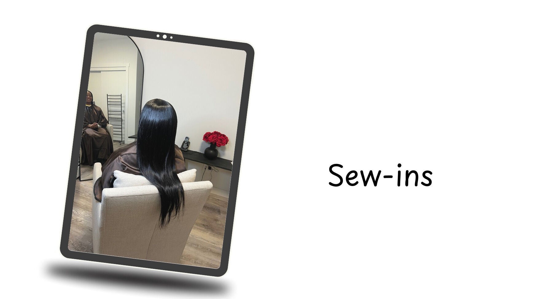 Hair styling at Crown & Co, Edmonton, Alberta, CA shown in a salon mirror with sleek long hair.