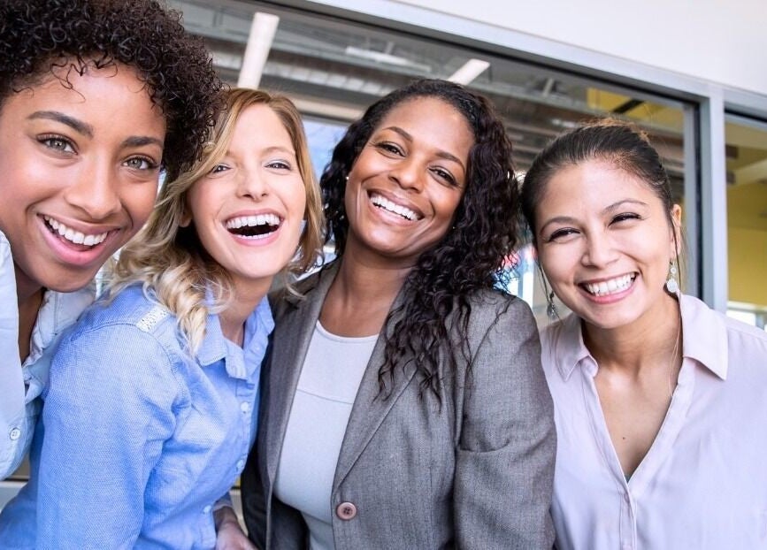 Happy clients at White and Bright Teeth Whitening Studio, Brisbane City, Queensland, AU, showcasing bright smiles.