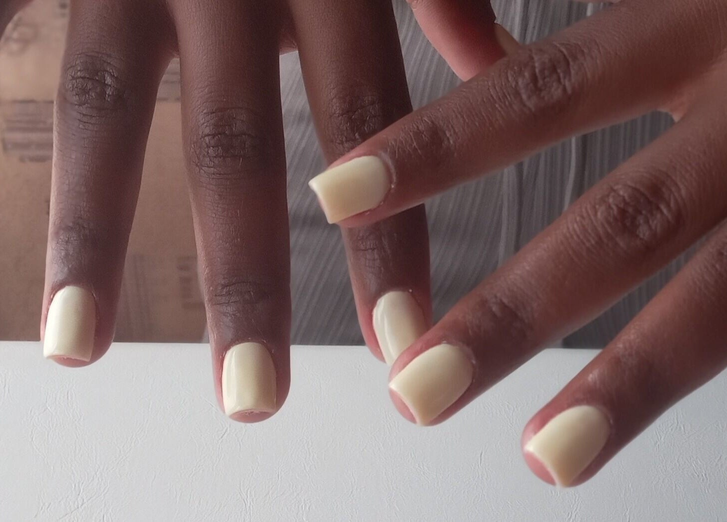 Polished nails in soft ivory from ZEE.NAILS at Sebokeng, Gauteng, ZA, showcasing expert nail care.