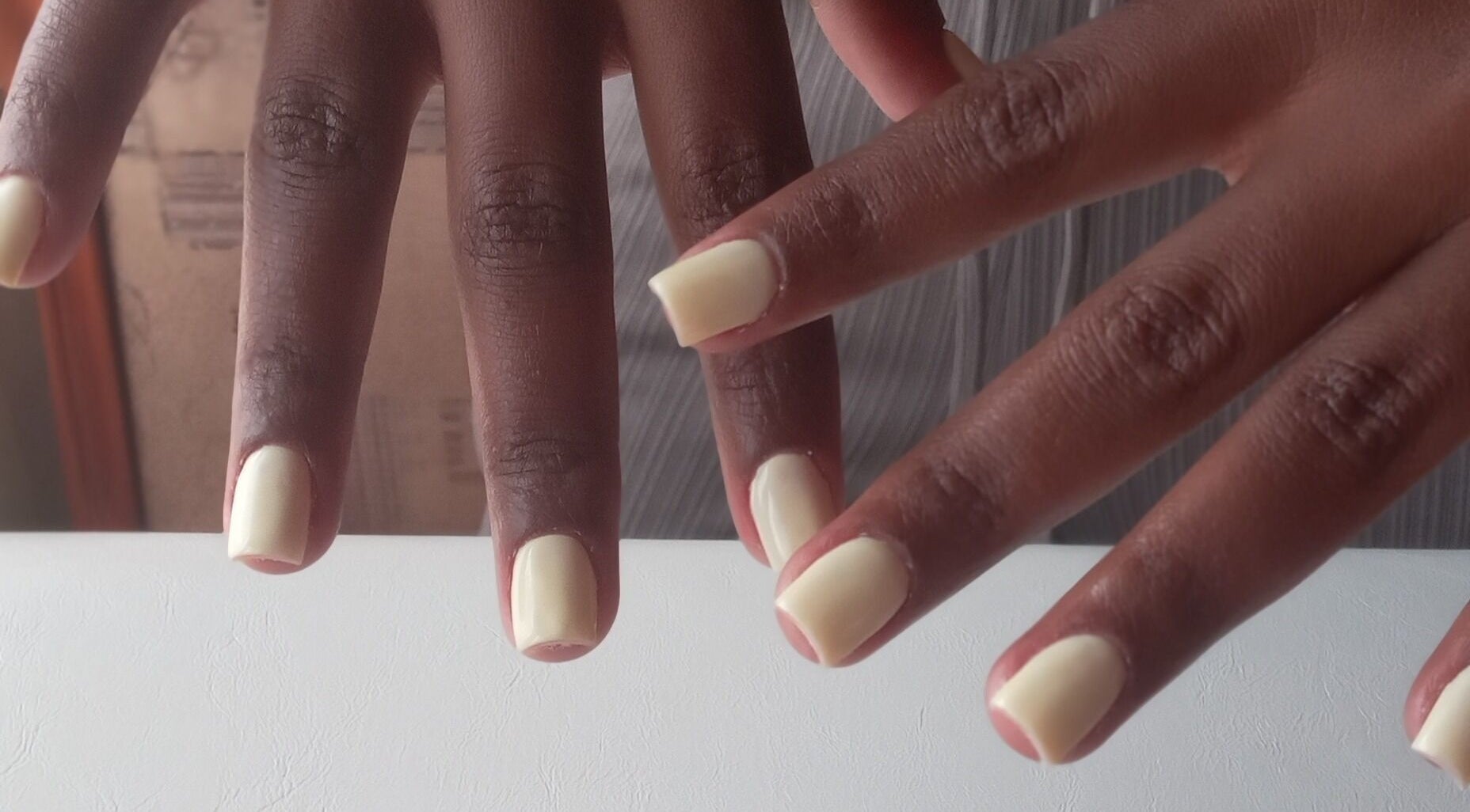 Polished nails in soft ivory from ZEE.NAILS at Sebokeng, Gauteng, ZA, showcasing expert nail care.