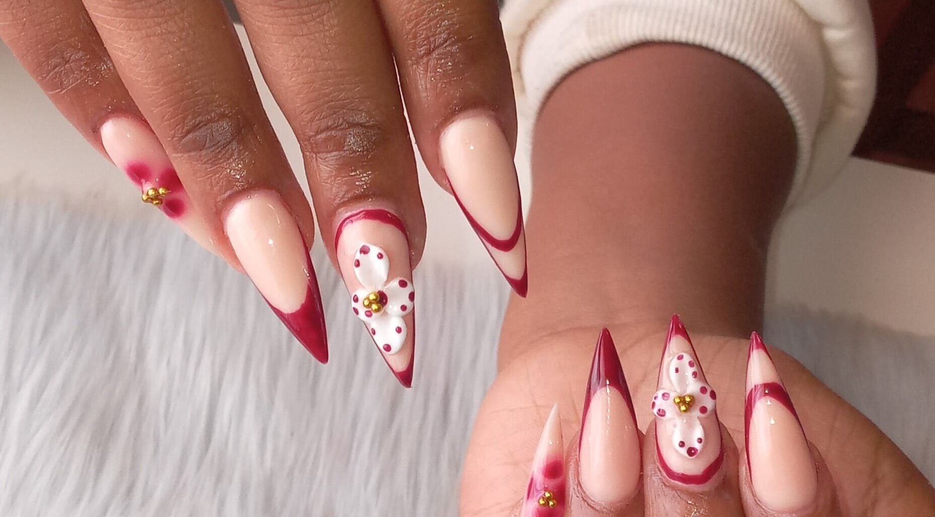 Stylish floral nail art at ZEE.NAILS, Sebokeng, Gauteng, ZA with red accents on natural nails.