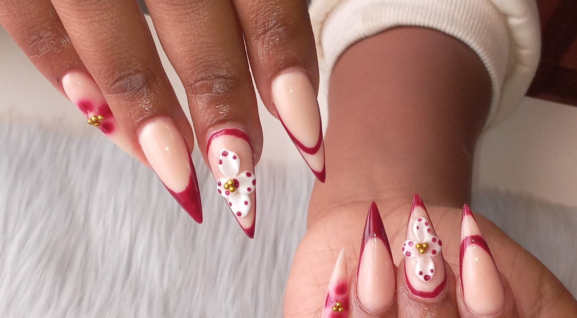 Stylish floral nail art at ZEE.NAILS, Sebokeng, Gauteng, ZA with red accents on natural nails.
