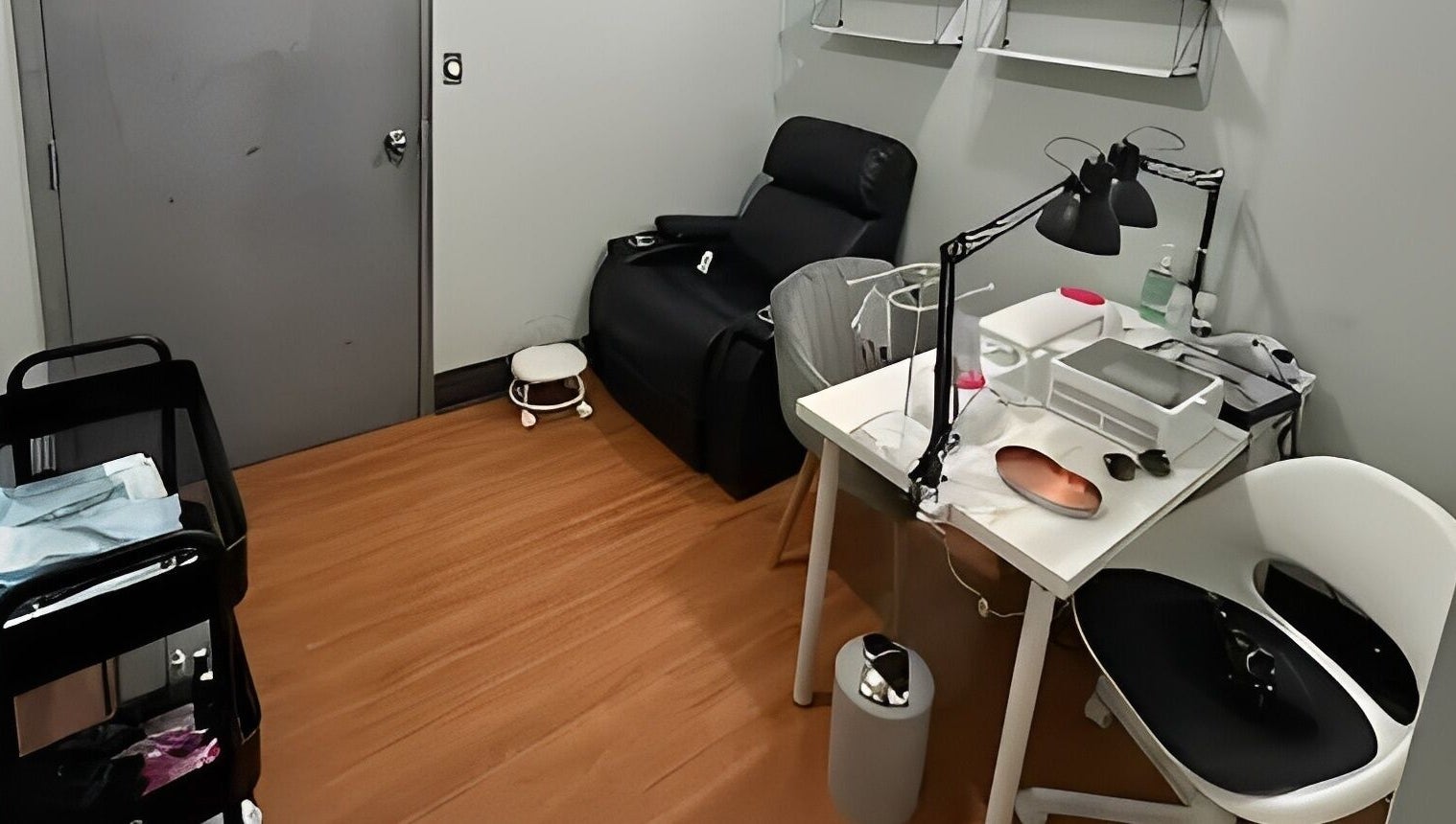 Comfortable treatment area at DZVINKA Beauty Studio, Edmonton, Alberta, CA, featuring a massage chair and workstation.