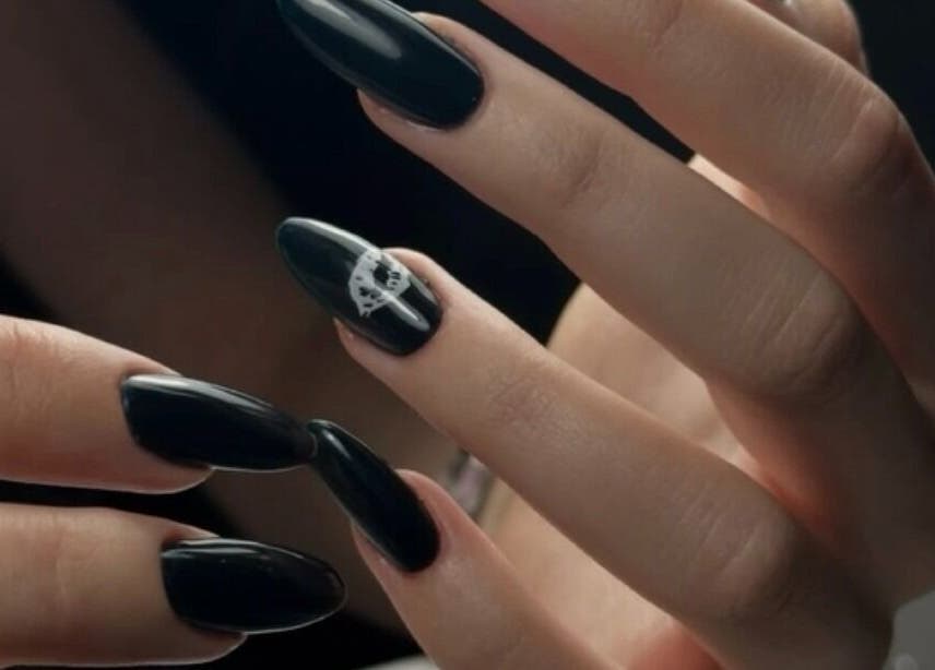 Elegant black nail art at DZVINKA Beauty Studio in Edmonton, Alberta, CA showcases modern sophistication.