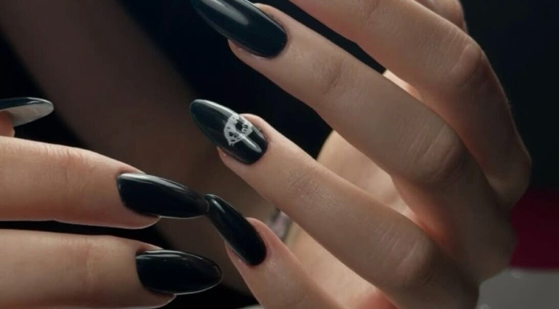 Elegant black nail art at DZVINKA Beauty Studio in Edmonton, Alberta, CA showcases modern sophistication.