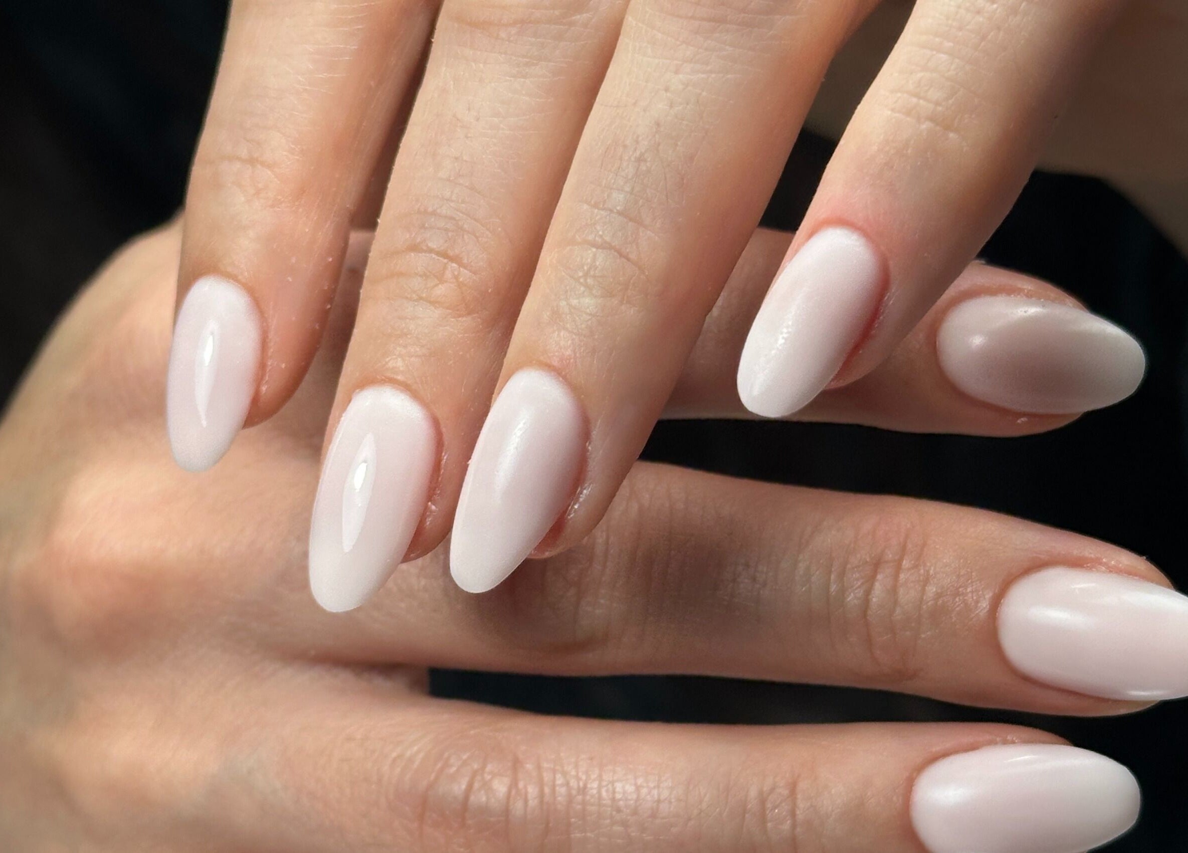 Elegant almond-shaped nails at DZVINKA Beauty Studio, Edmonton, Alberta, CA.