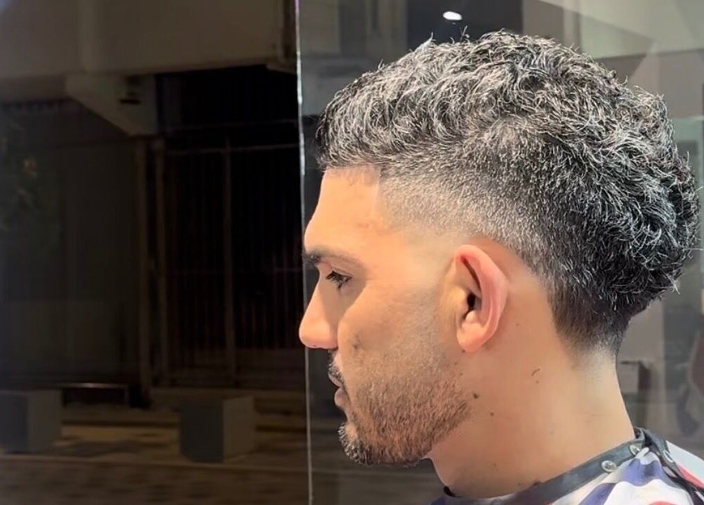 Fresh fade haircut at Mario London Barber Shop, Larnaka, Larnaka, CY. Side profile of a man's stylish cut.