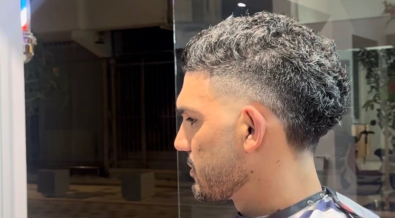 Fresh fade haircut at Mario London Barber Shop, Larnaka, Larnaka, CY. Side profile of a man's stylish cut.