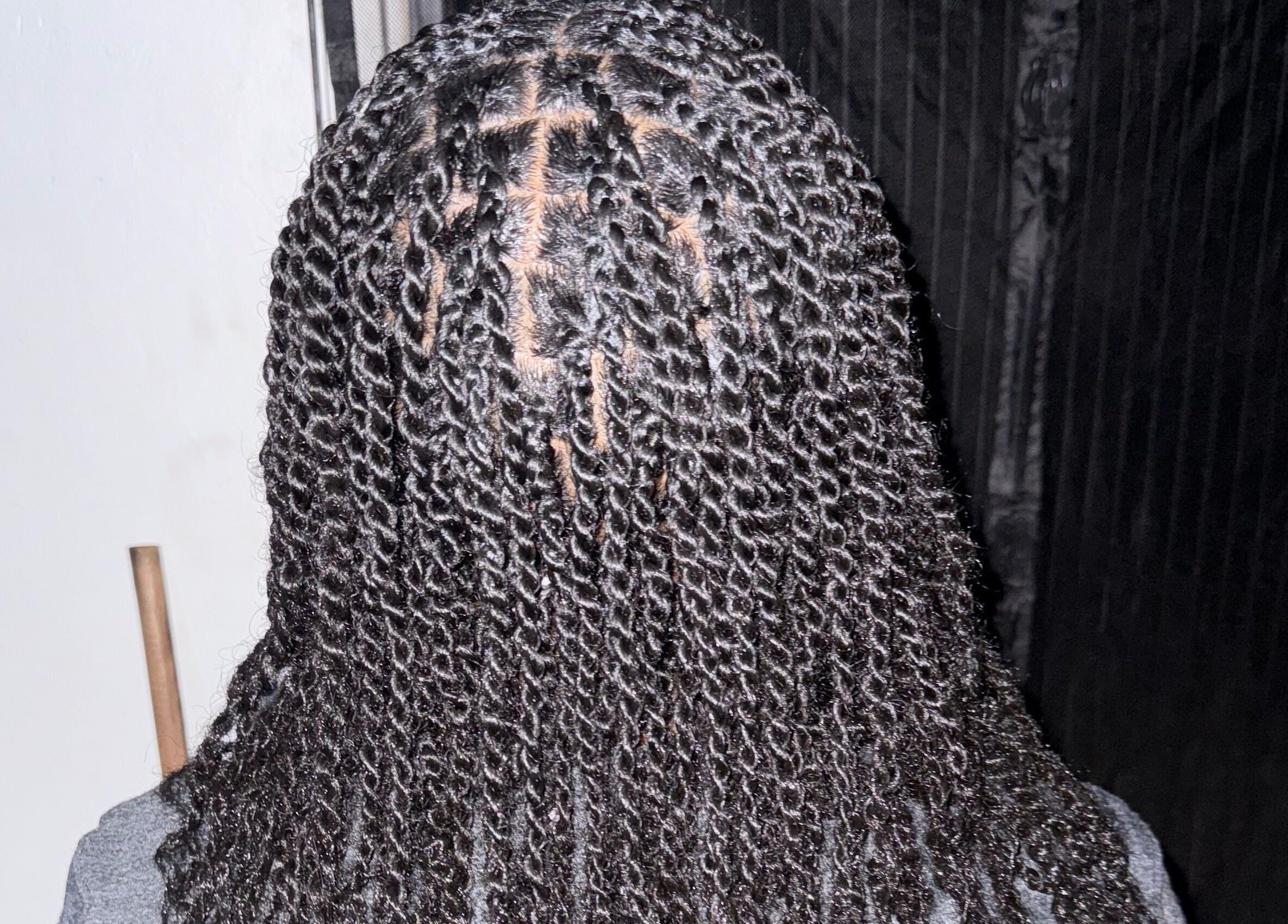 Intricate twist hairstyle at JR Stylez, located in Montego Bay, St. James Parish, JM.