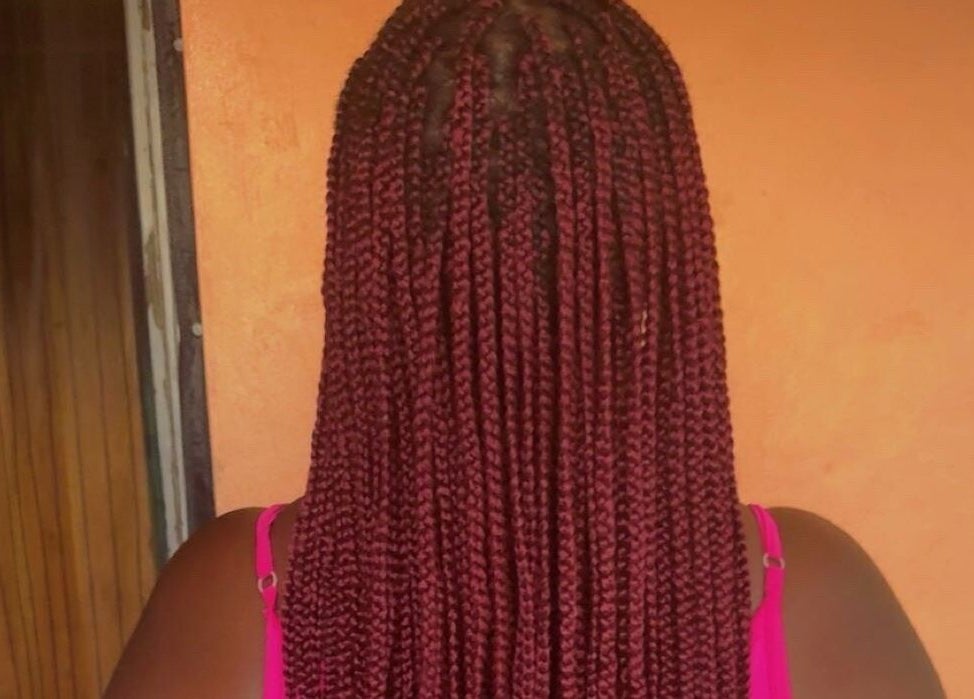 Detailed back view of red braided hairstyle at JR Stylez, Montego Bay, St. James Parish, JM.