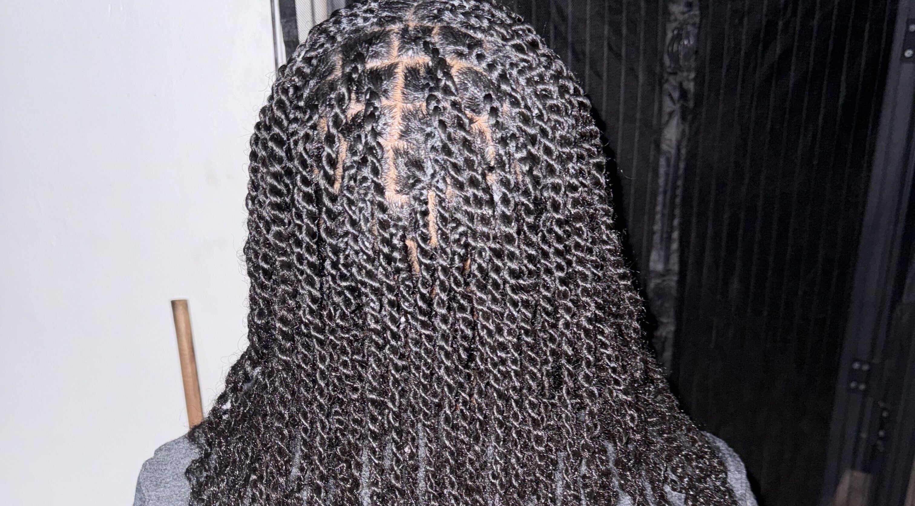 Intricate twist hairstyle captured at JR Stylez in Montego Bay, St. James Parish, JM.