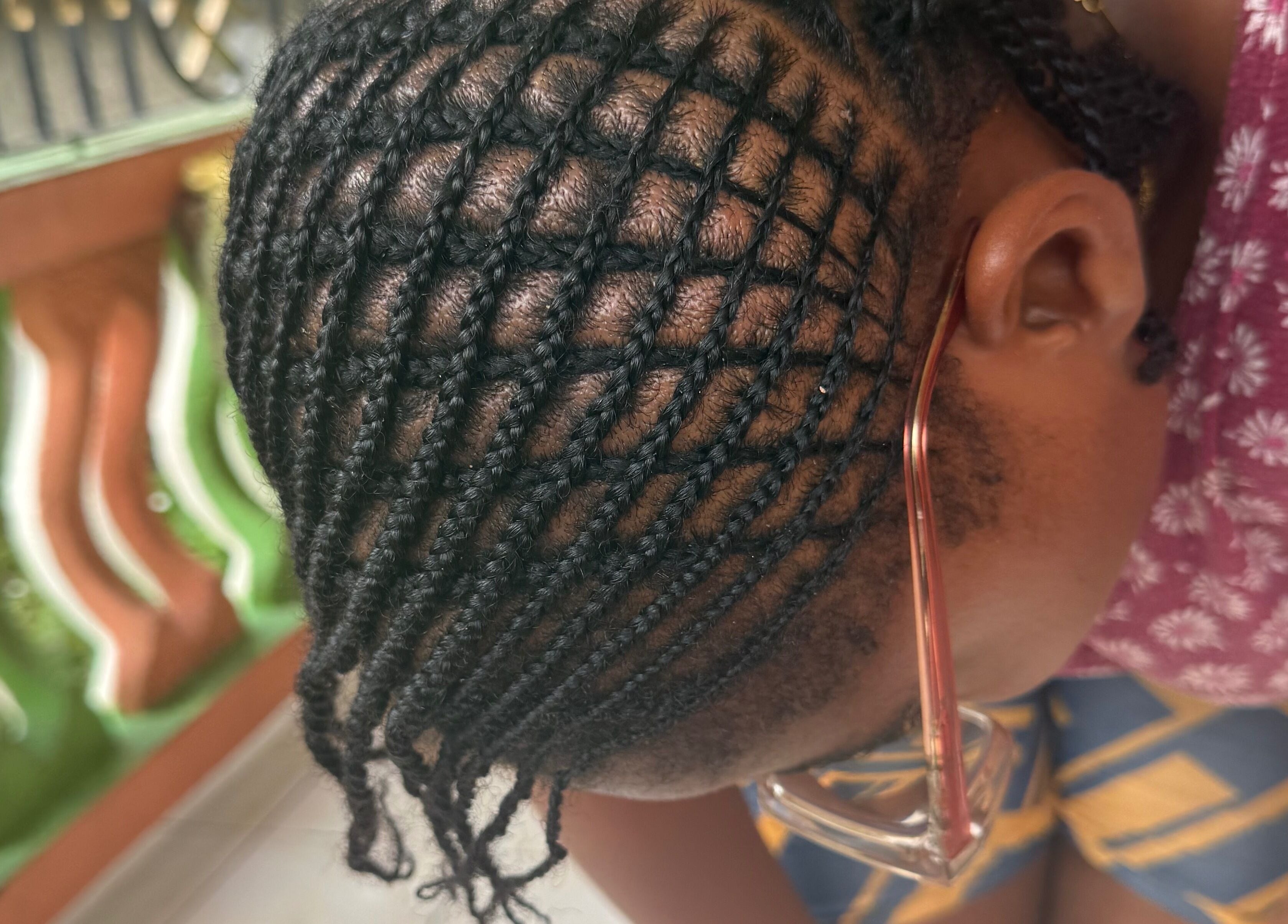 Intricate cornrow hairstyle at JR Stylez, Montego Bay, St. James Parish, JM. Perfectly detailed for a chic look.