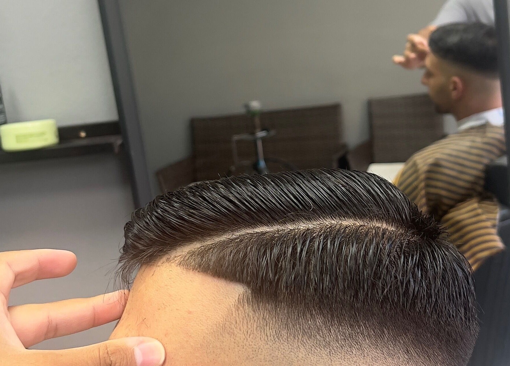 Modern haircut at NALDO HAIR STUDIO, Neapoli, GR. Expert styling showcased with precise lines.