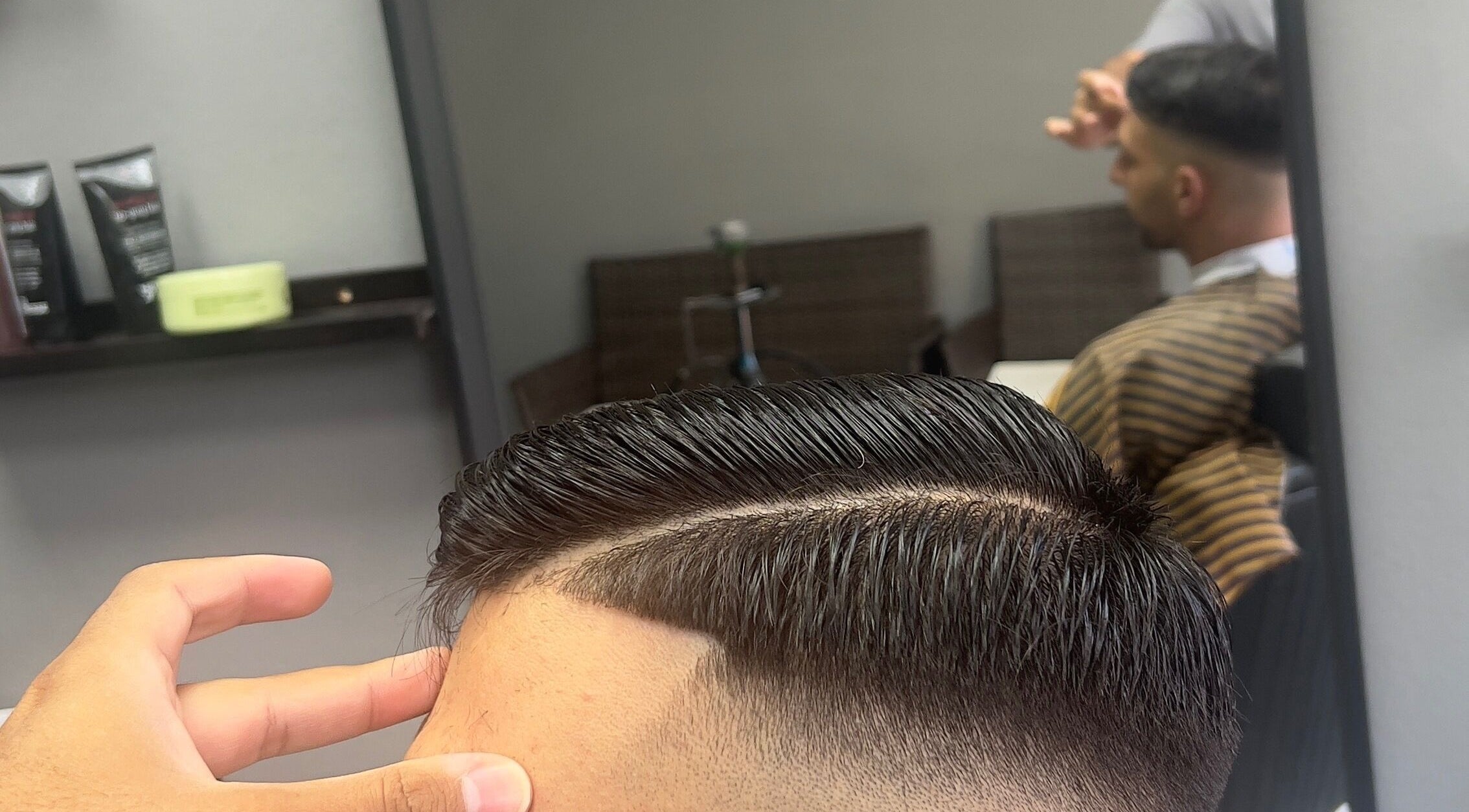 Modern haircut at NALDO HAIR STUDIO, Neapoli, GR. Expert styling showcased with precise lines.