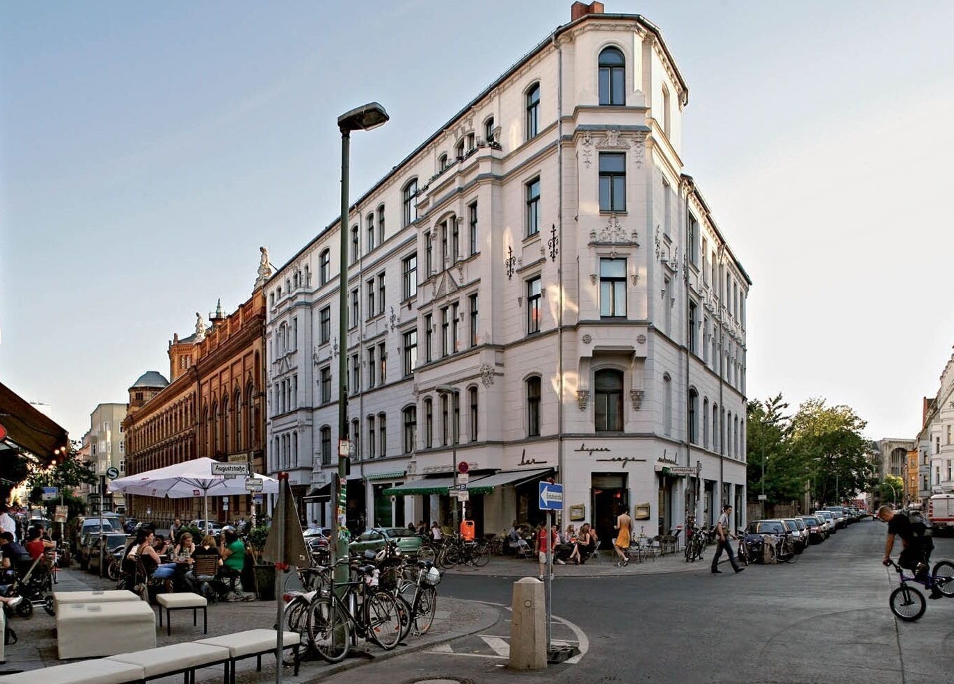 Bustling street view near Test venue, Berlin, Berlin, DE, with people dining outside.