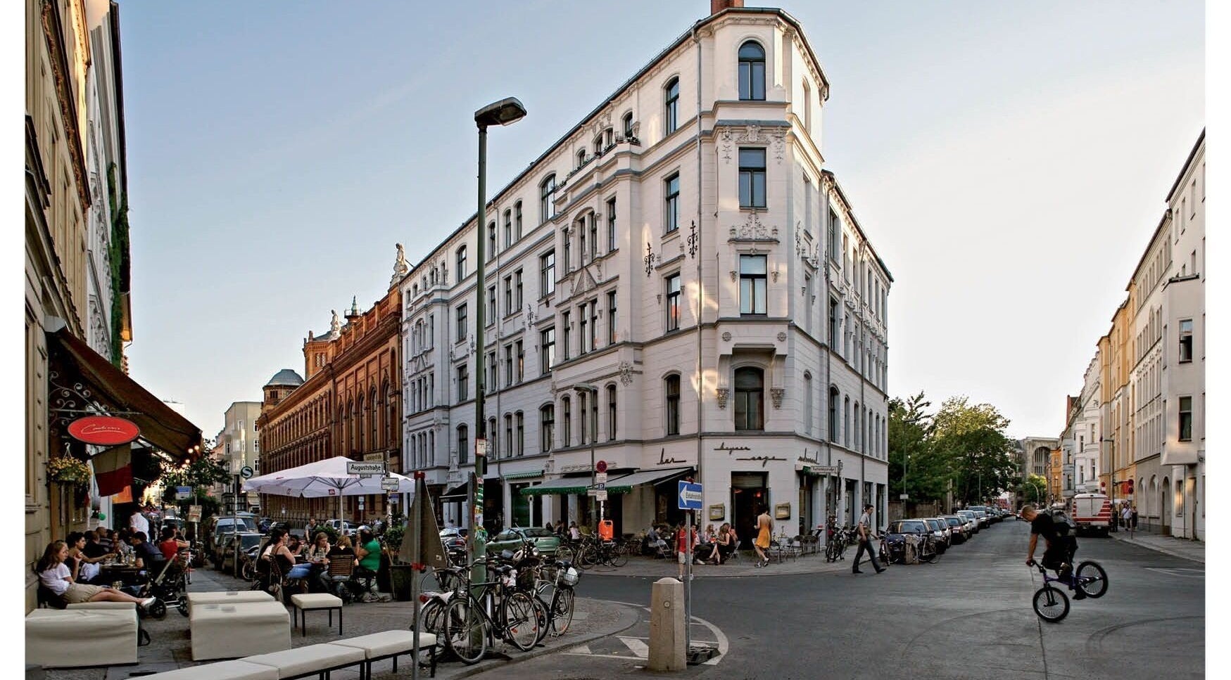 Bustling street view near Test venue, Berlin, Berlin, DE, with people dining outside.