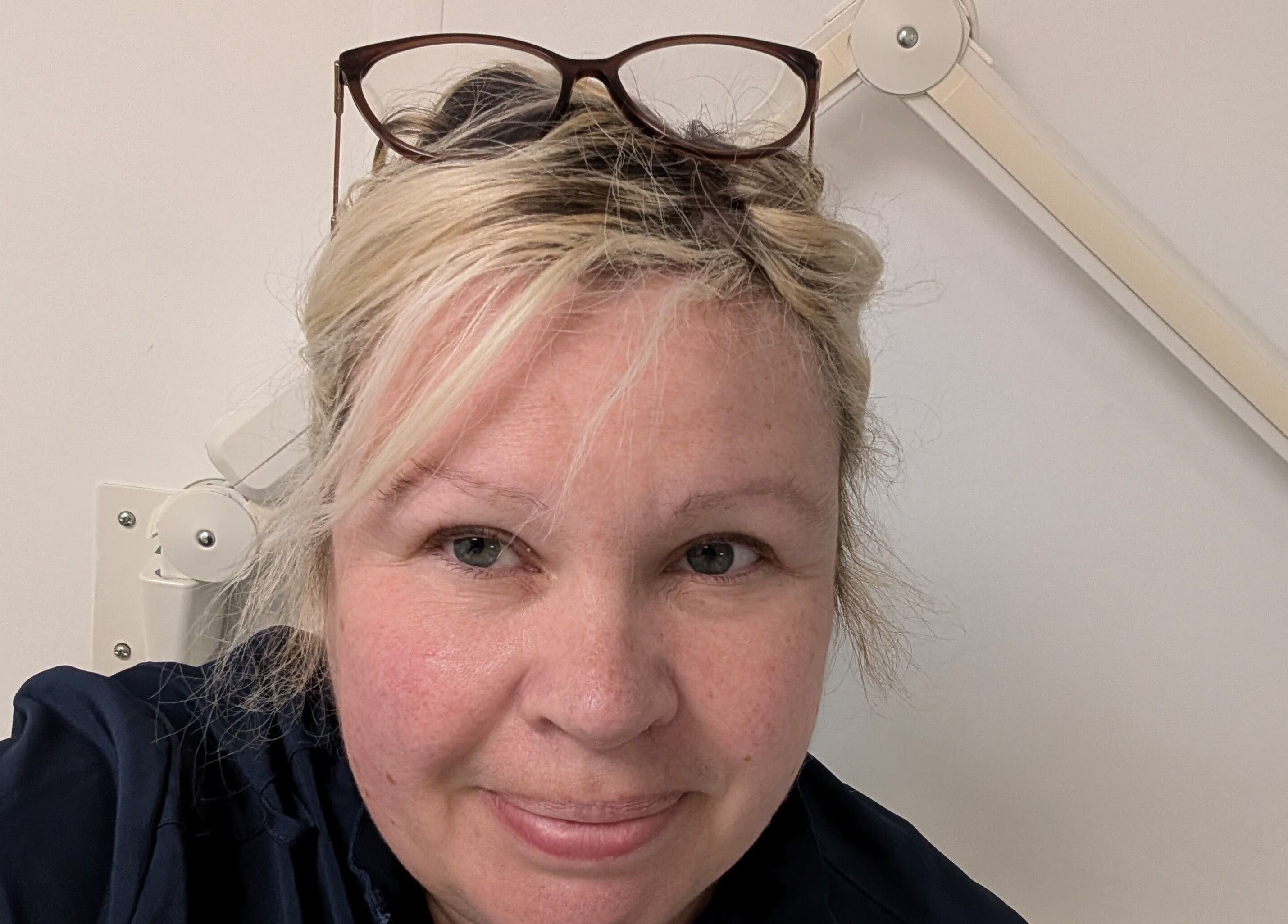 Friendly staff member at Insta Aesthetics, Ashton-under-lyne, England, GB, showcasing expert care in beauty services.