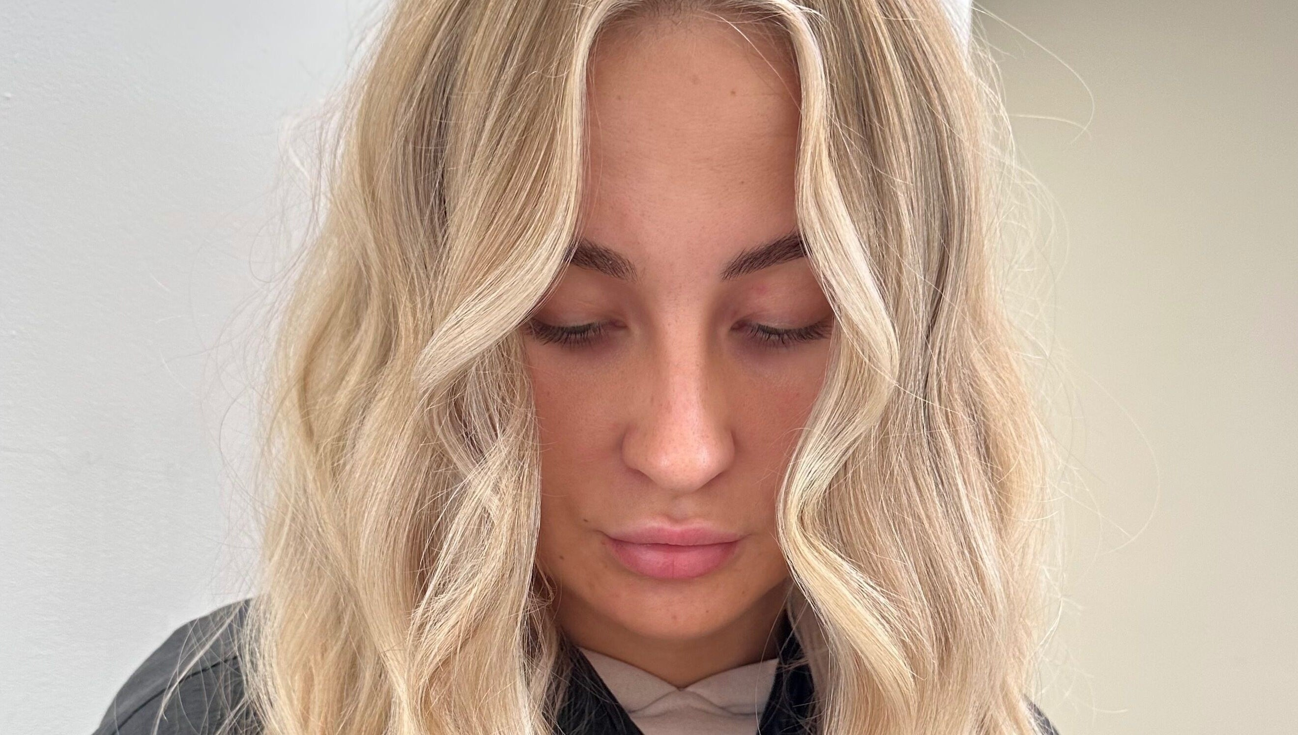 Elegant blonde waves styled at Luxury Locks, Oakley, England, GB.