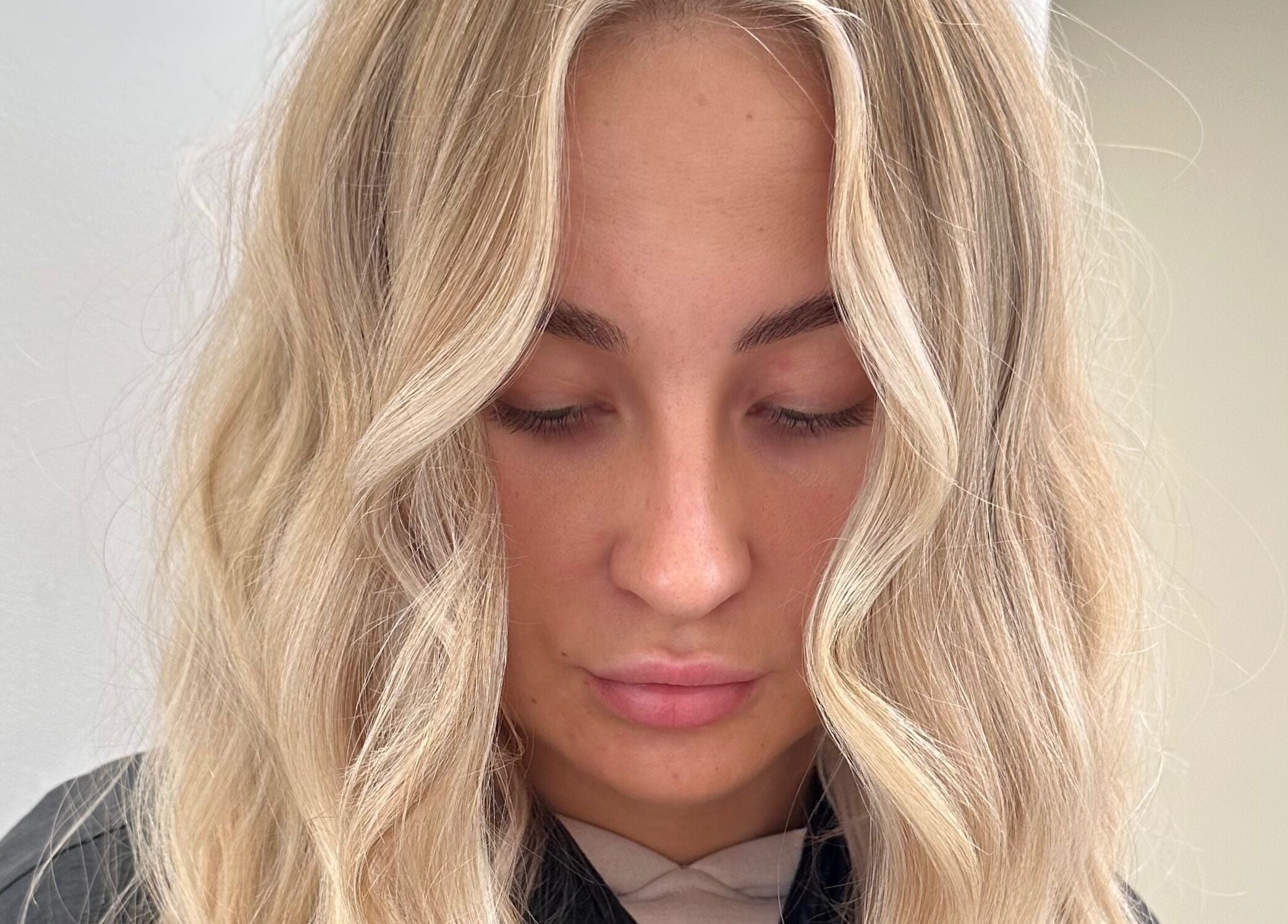 Elegant blonde waves styled at Luxury Locks, Oakley, England, GB.