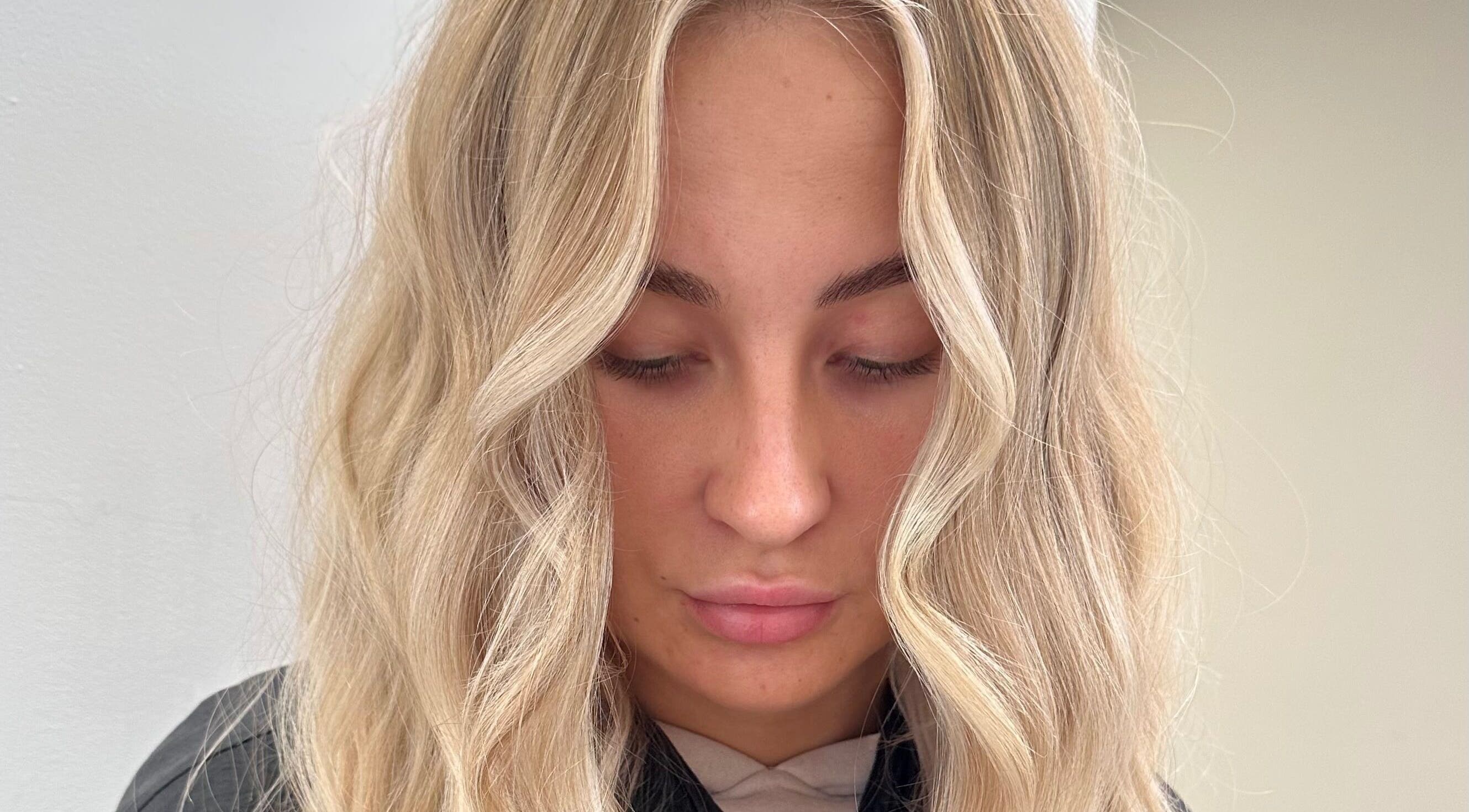 Elegant blonde waves styled at Luxury Locks, Oakley, England, GB.