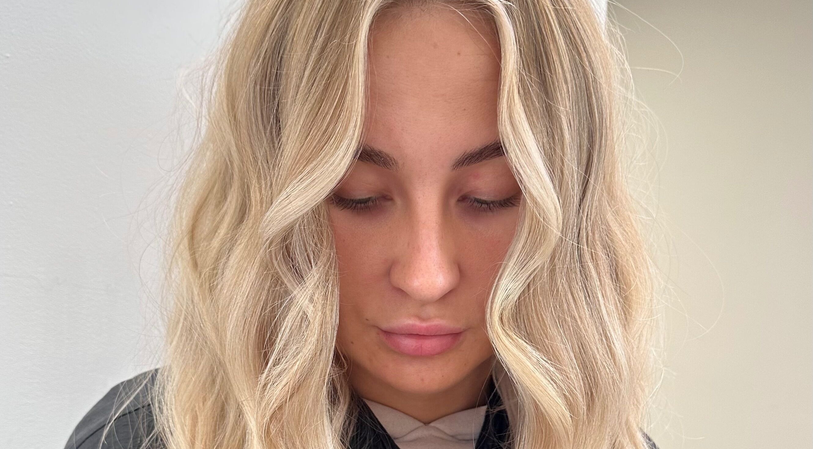 Elegant blonde waves styled at Luxury Locks, Oakley, England, GB.