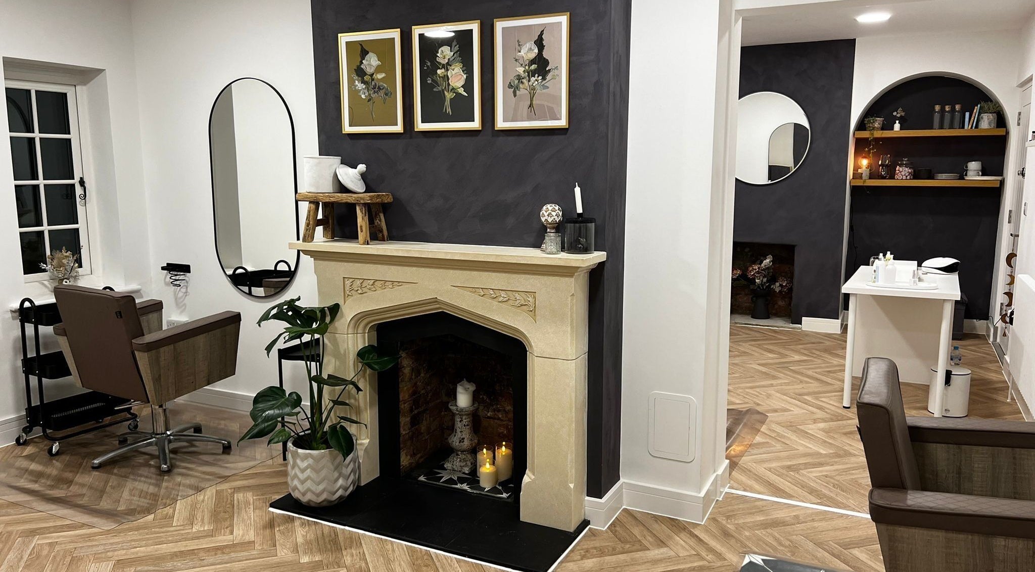 Stylish interior of Luxury Locks salon with modern chairs and decor in Oakley, England, GB.