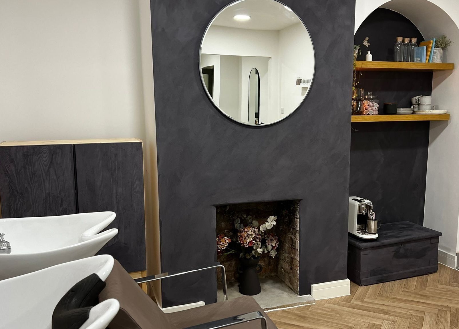 Modern interior of Luxury Locks salon featuring stylish sinks and decor in Oakley, England, GB.