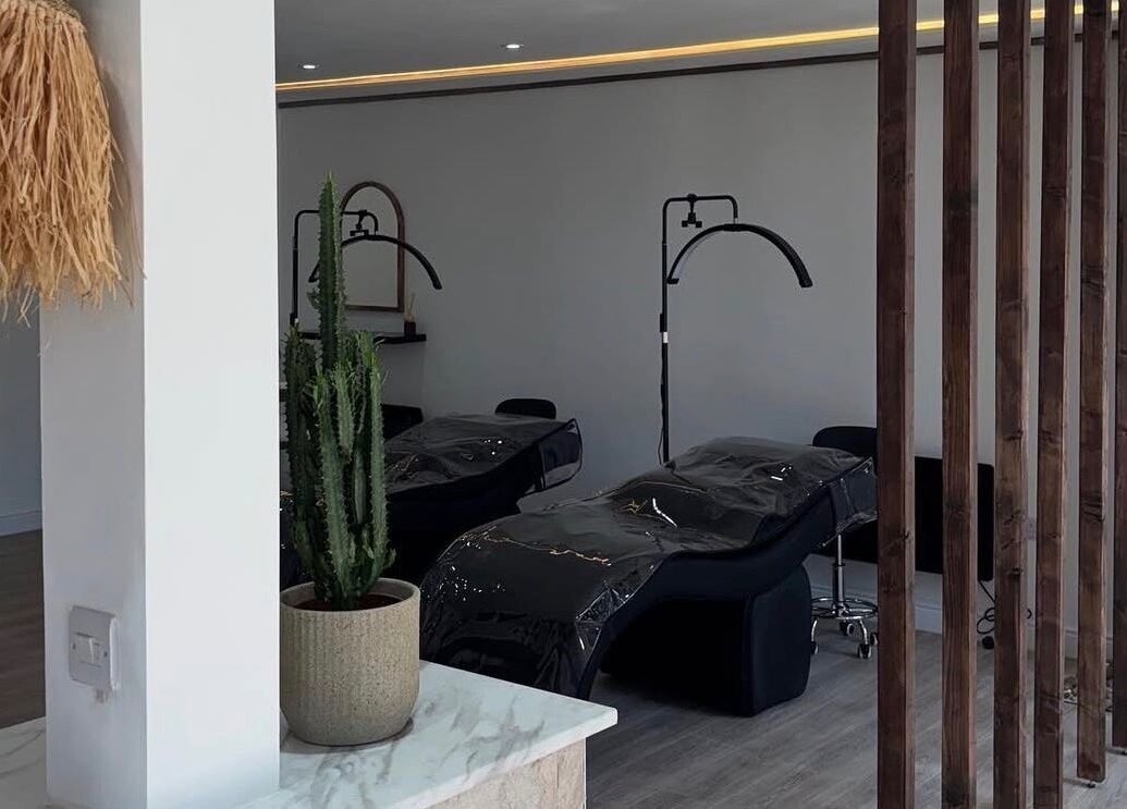 Relaxing interior of Signature Brows CO, Flint, Wales, GB, featuring plush beds and elegant decor.