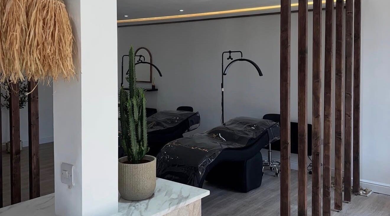 Relaxing interior of Signature Brows CO, Flint, Wales, GB, featuring plush beds and elegant decor.