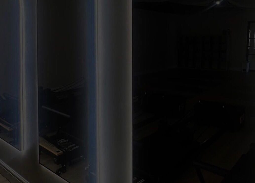 Calm interior of Signature Brows CO, Flint, Wales, GB, featuring sleek mirrors and serene ambiance.