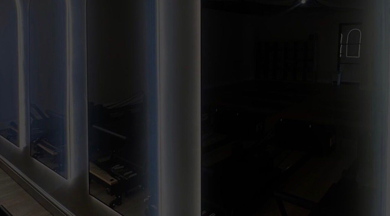 Calm interior of Signature Brows CO, Flint, Wales, GB, featuring sleek mirrors and serene ambiance.