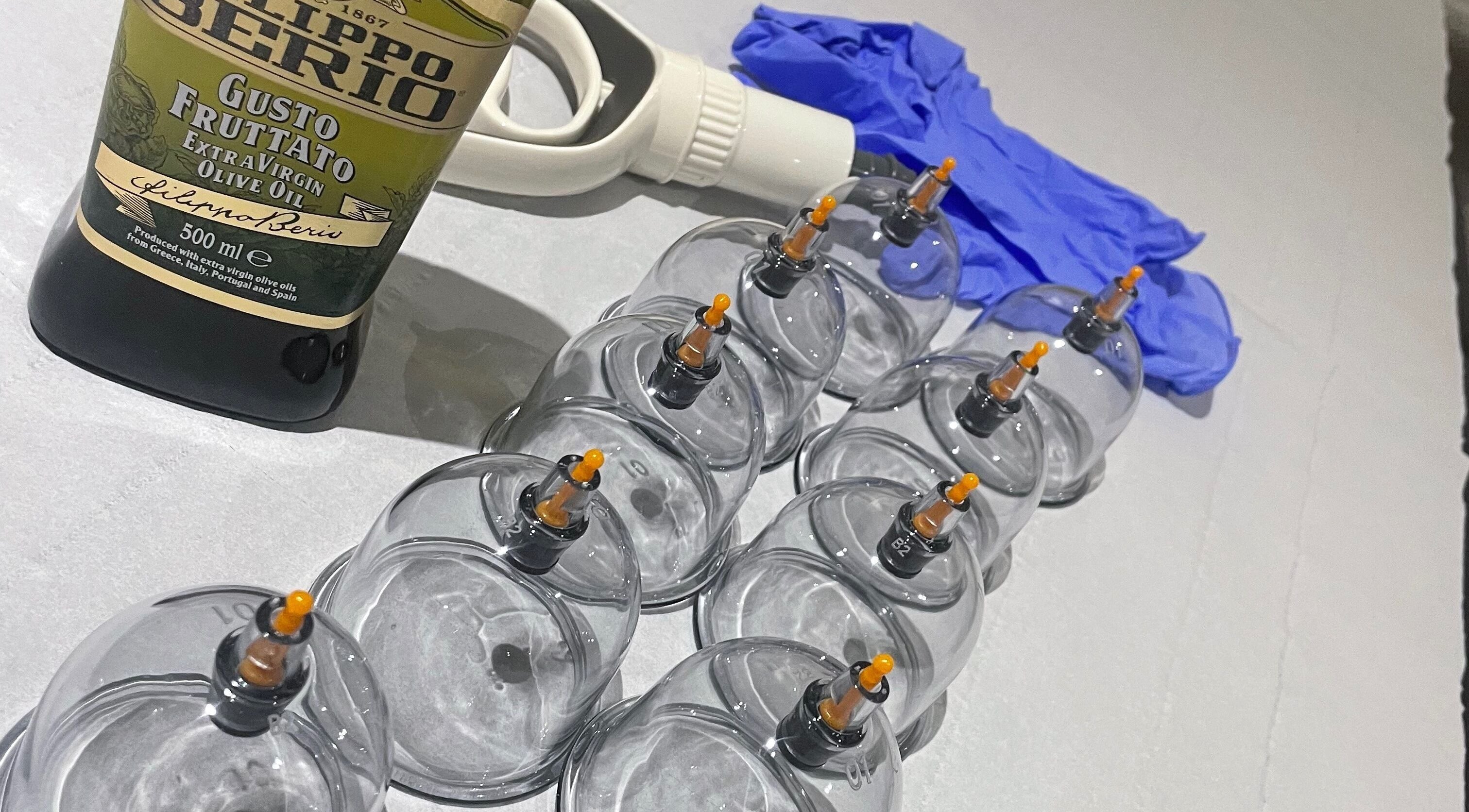 Cupping tools at Cupping By Hamza, Adlington, England, GB, including cups, olive oil, and gloves.