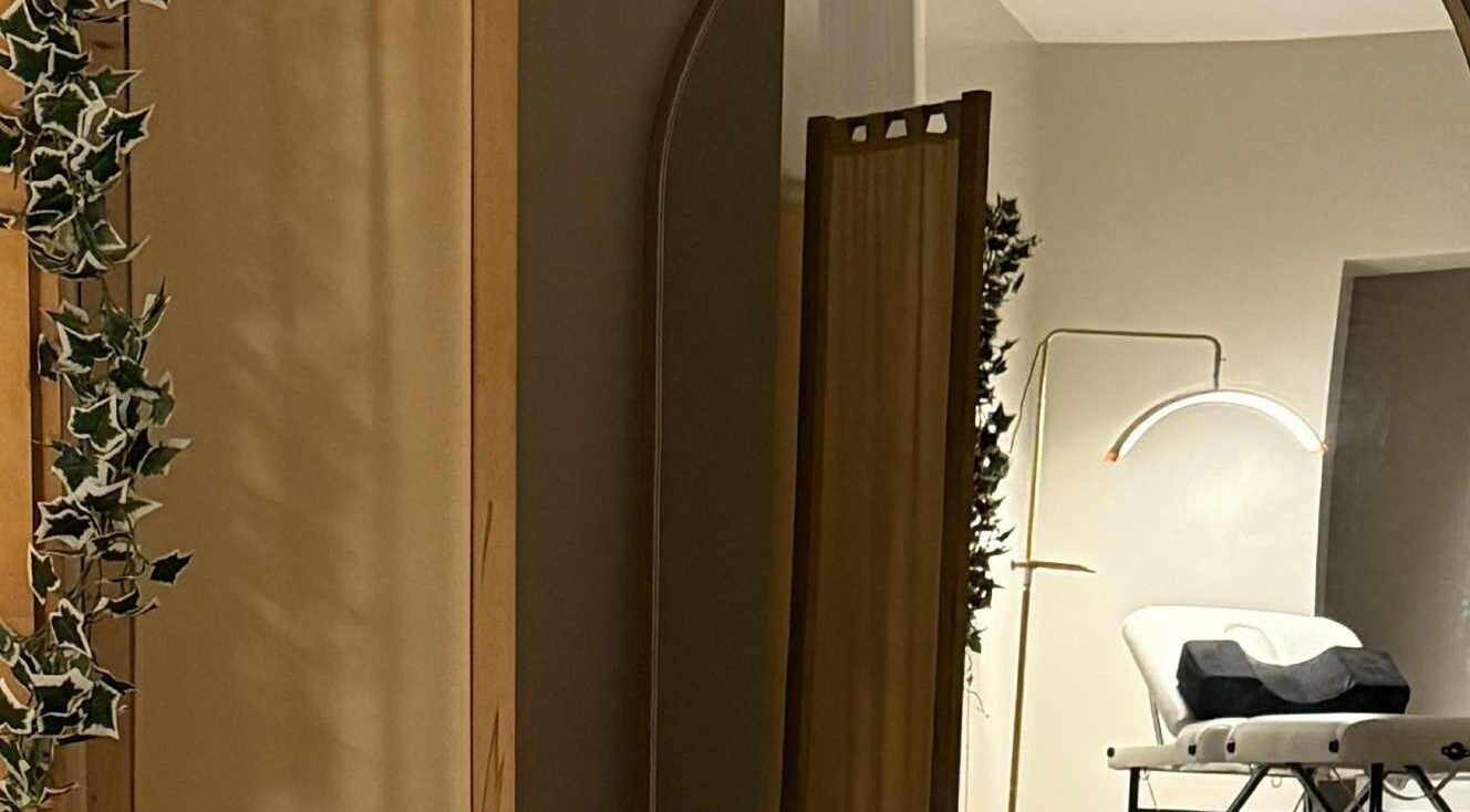 Relaxing treatment room at The Beauty Lab, Newark-on-trent, England, GB with a treatment bed and ambient lighting.