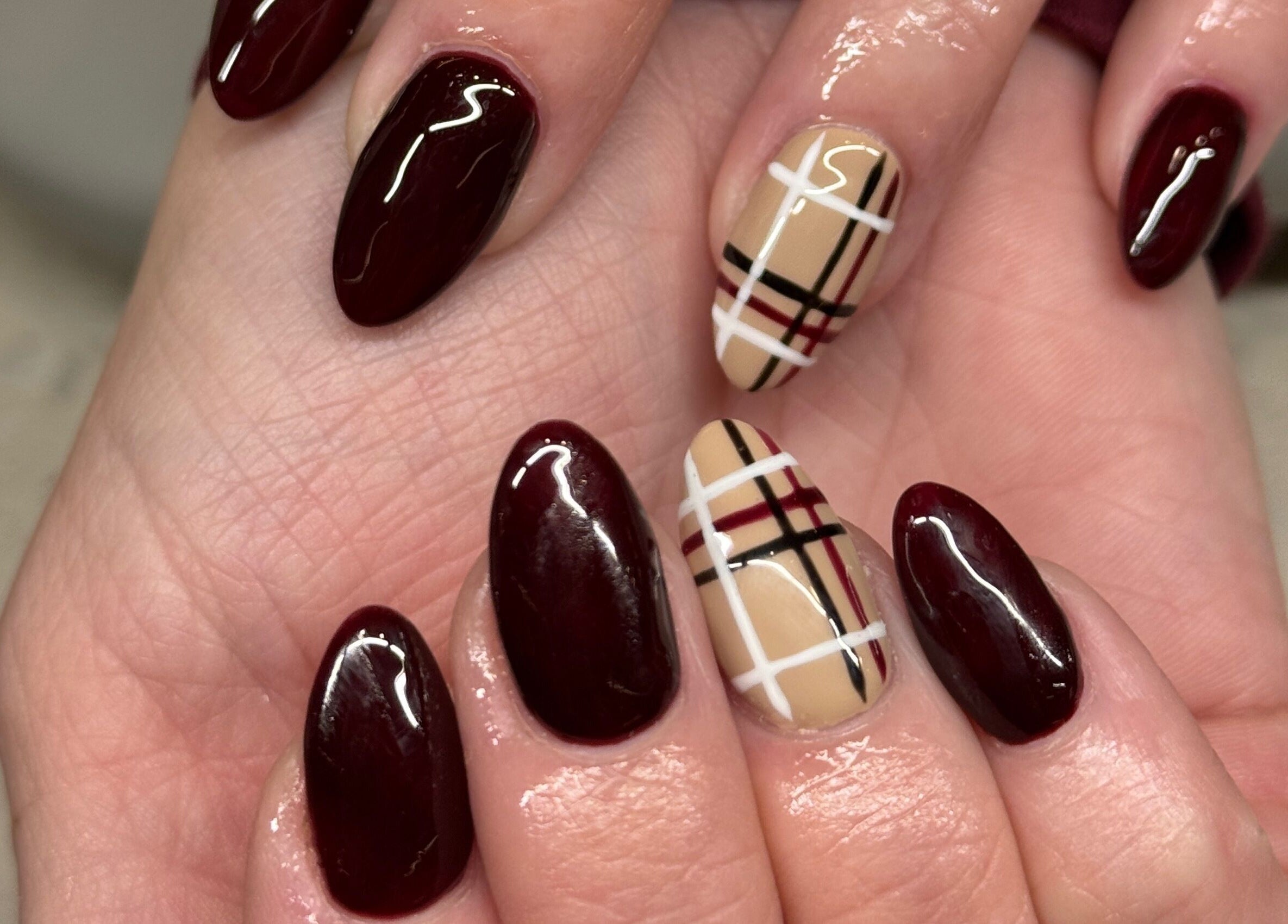 Elegant burgundy and plaid nail art by Nails by Orion in Port St. Lucie, Florida, US.