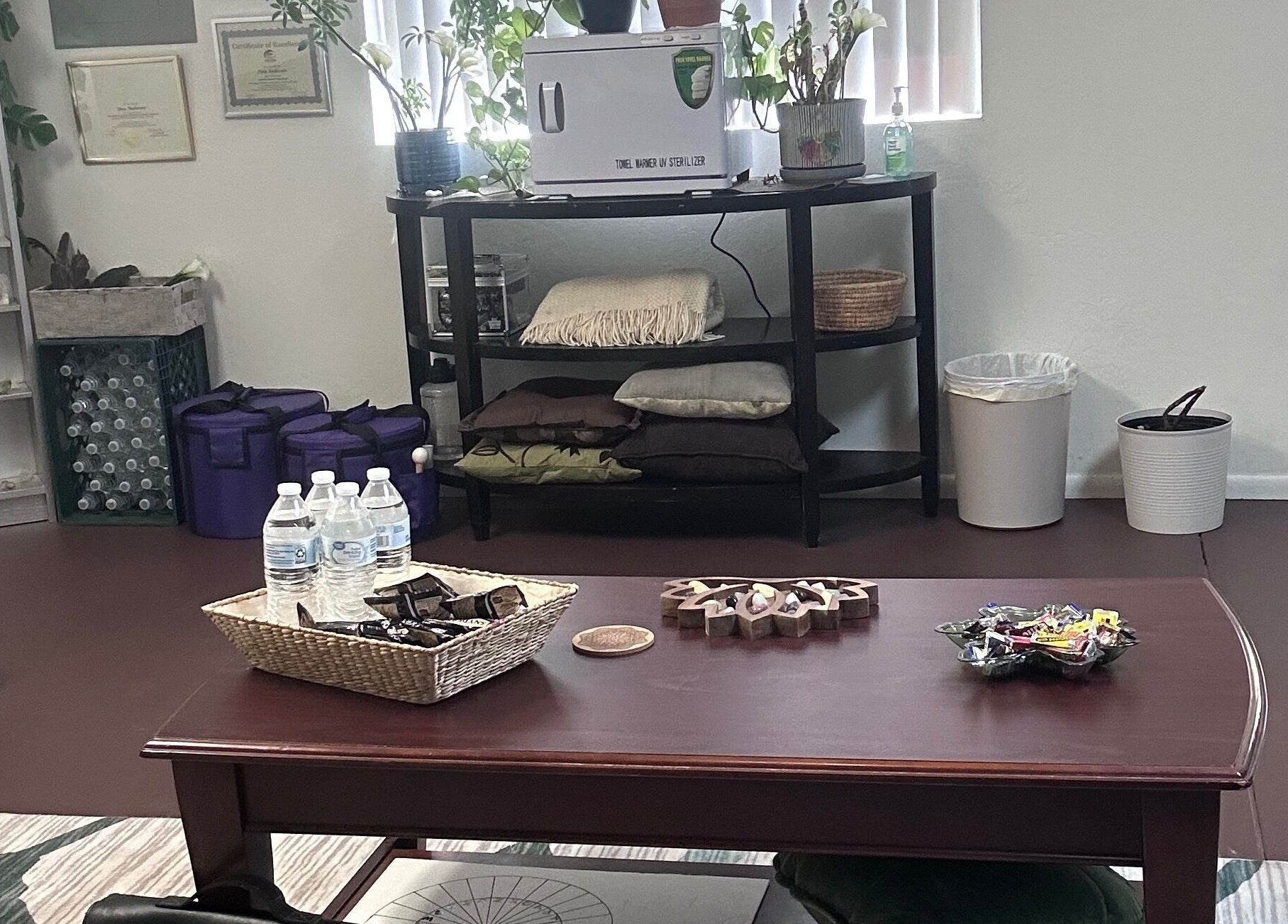 Relaxing interior of Tina Andersen's wellness space in Cottonwood, Arizona, US with water bottles and decor.