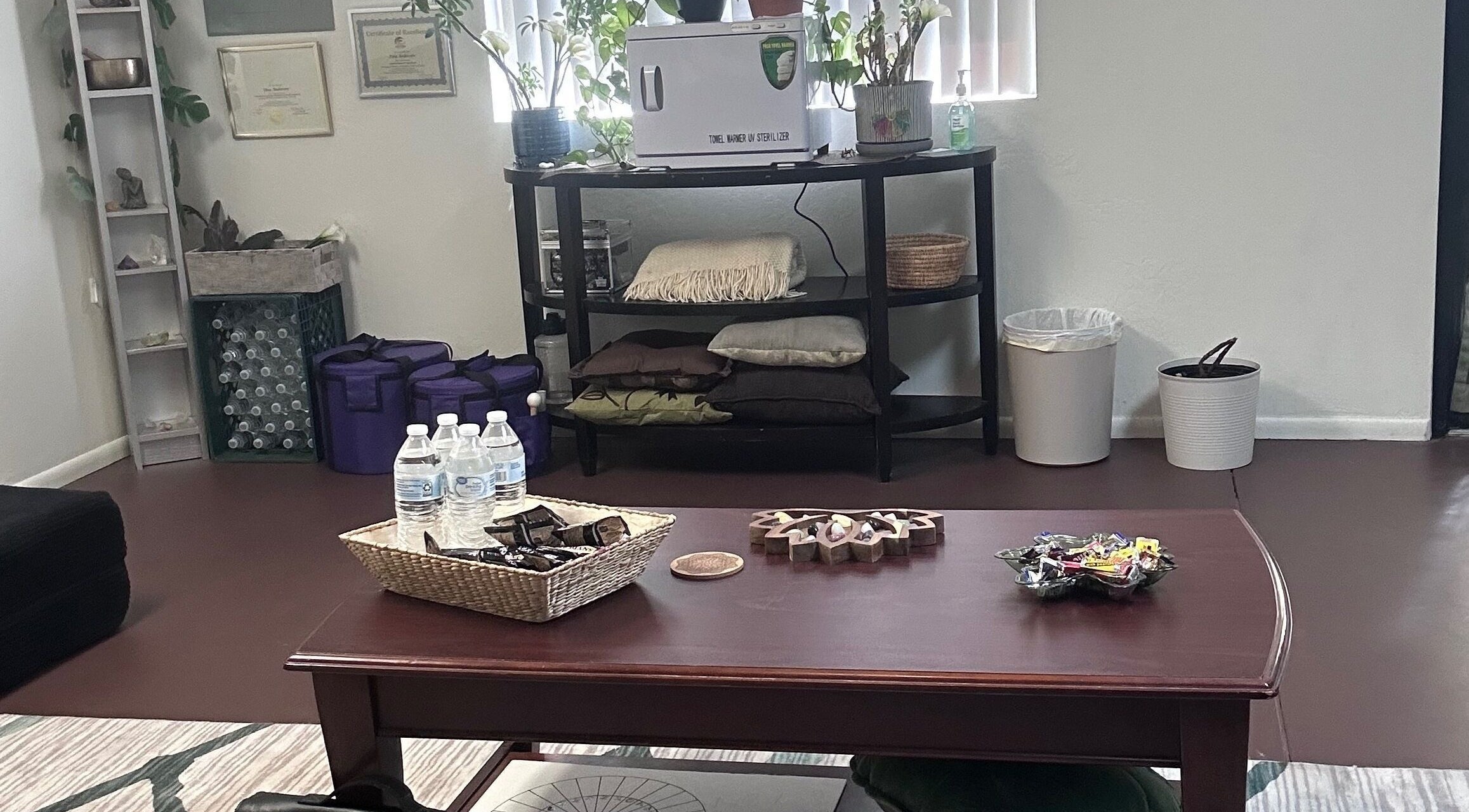Relaxing interior of Tina Andersen's wellness space in Cottonwood, Arizona, US with water bottles and decor.