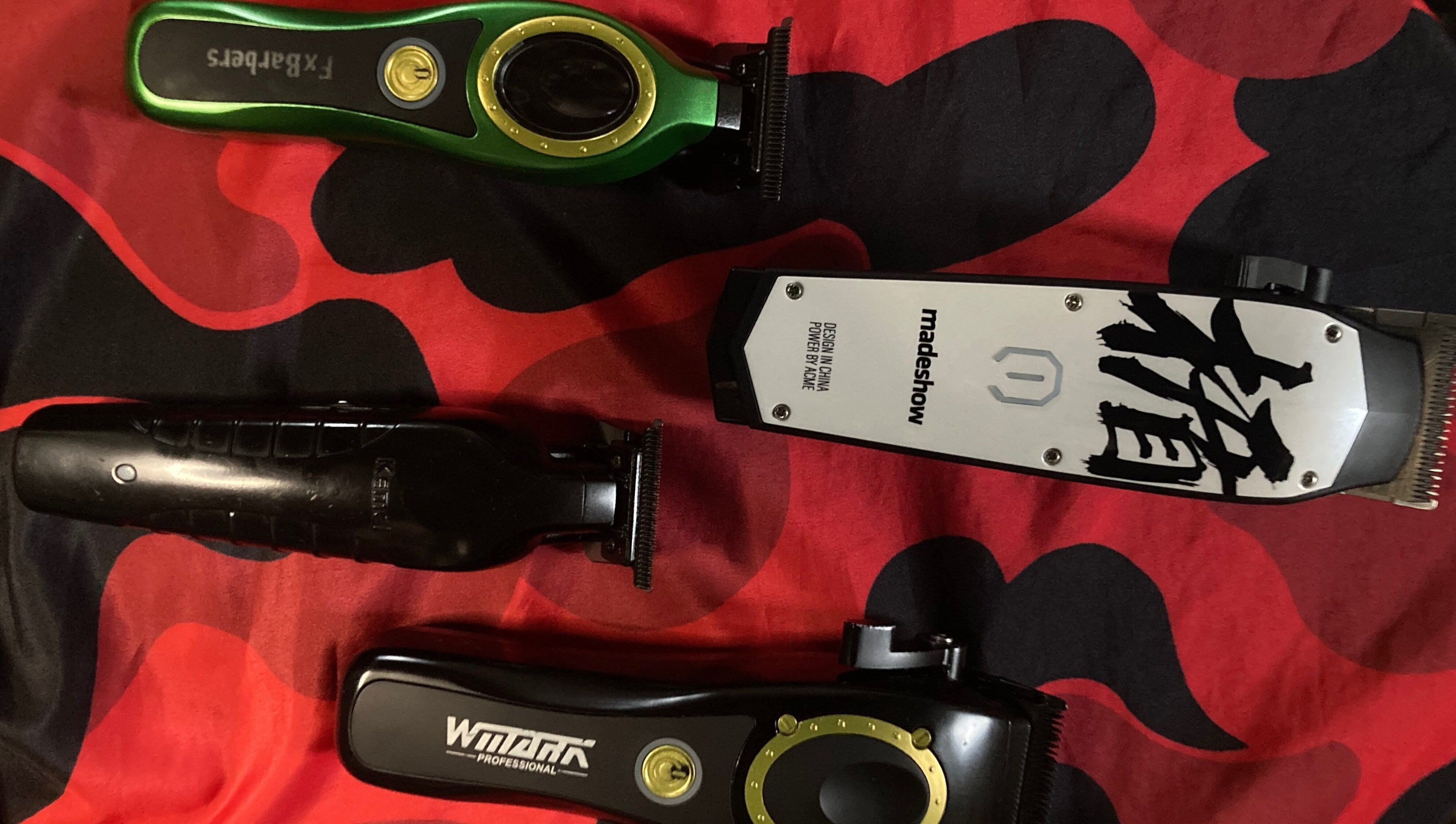 Diverse barber clippers on vibrant cloth at BARBERJAY, Cainta, Calabarzon, PH.