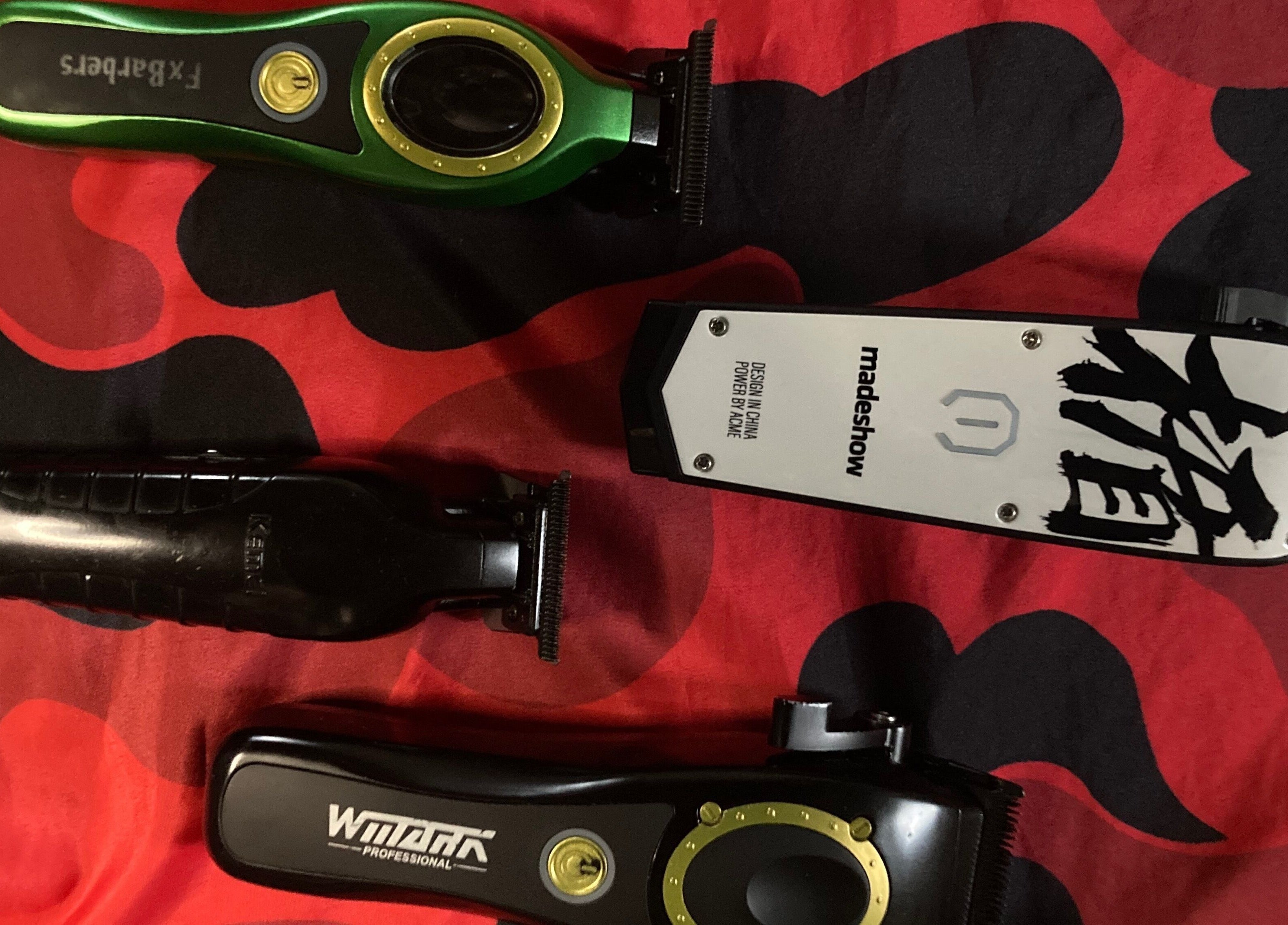 Diverse barber clippers on vibrant cloth at BARBERJAY, Cainta, Calabarzon, PH.